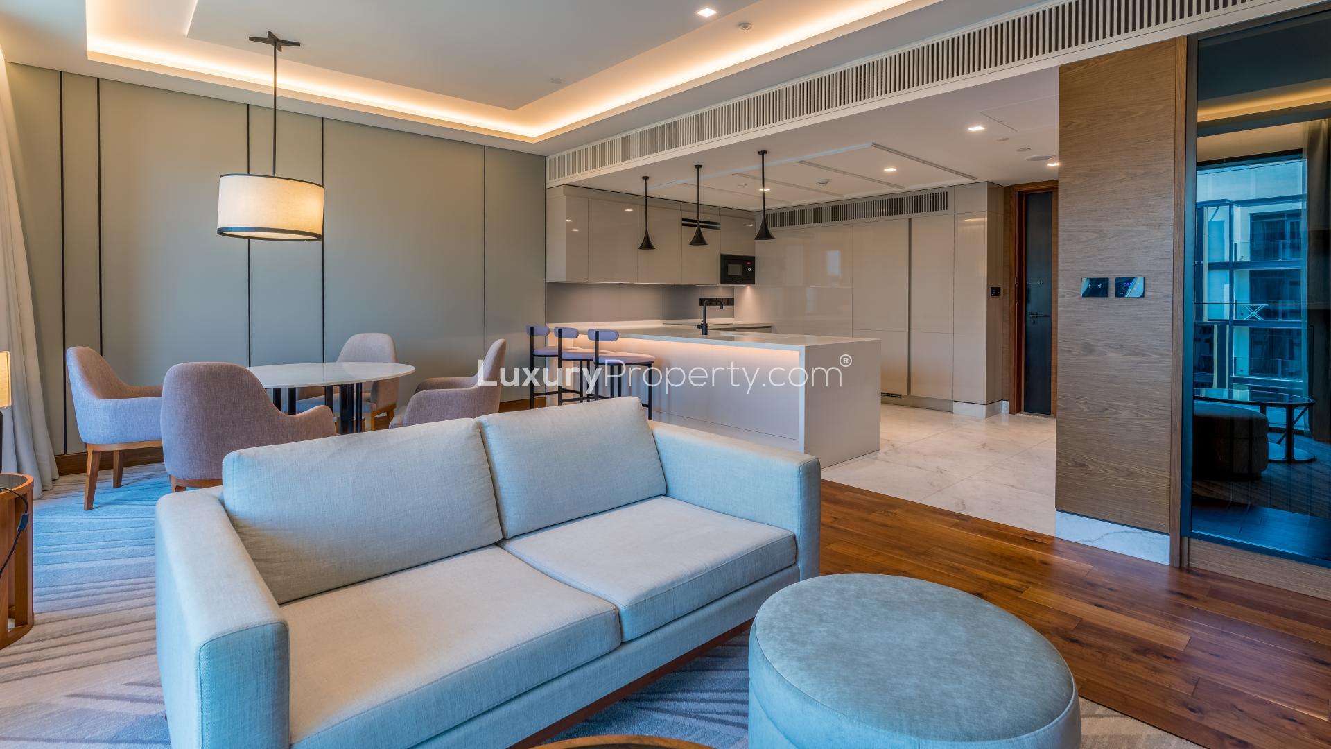 Exterior view of Caesars Bluewaters Dubai apartment with sea view and palm-lined pathways