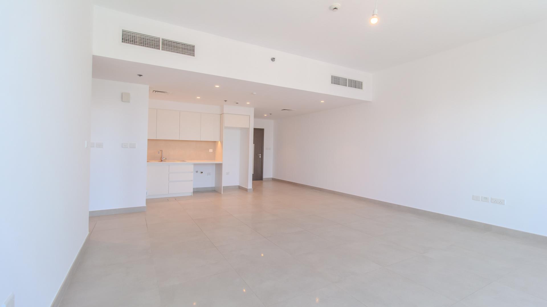 Modern kitchen interior in high-floor Creek Horizon apartment, Dubai Creek Harbour