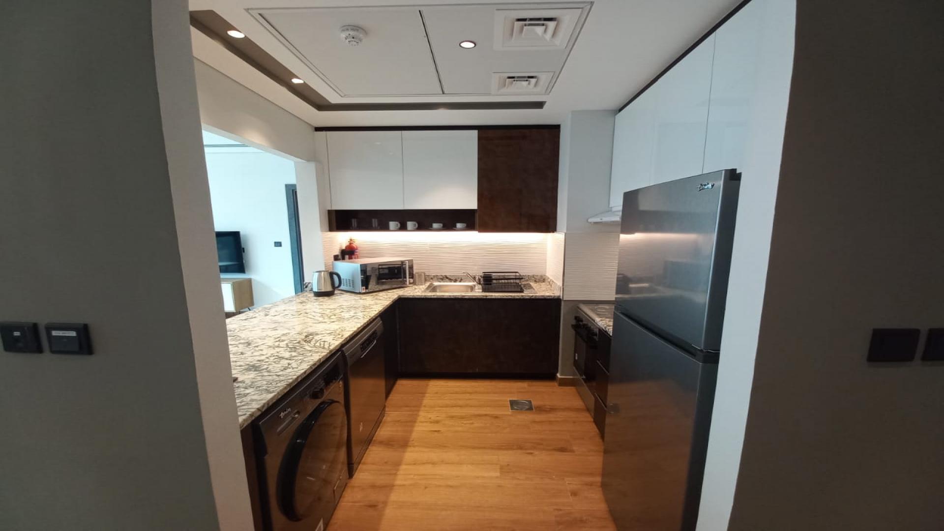Furnished kitchen in Dubai Marina apartment for rent, granite countertops, modern appliances