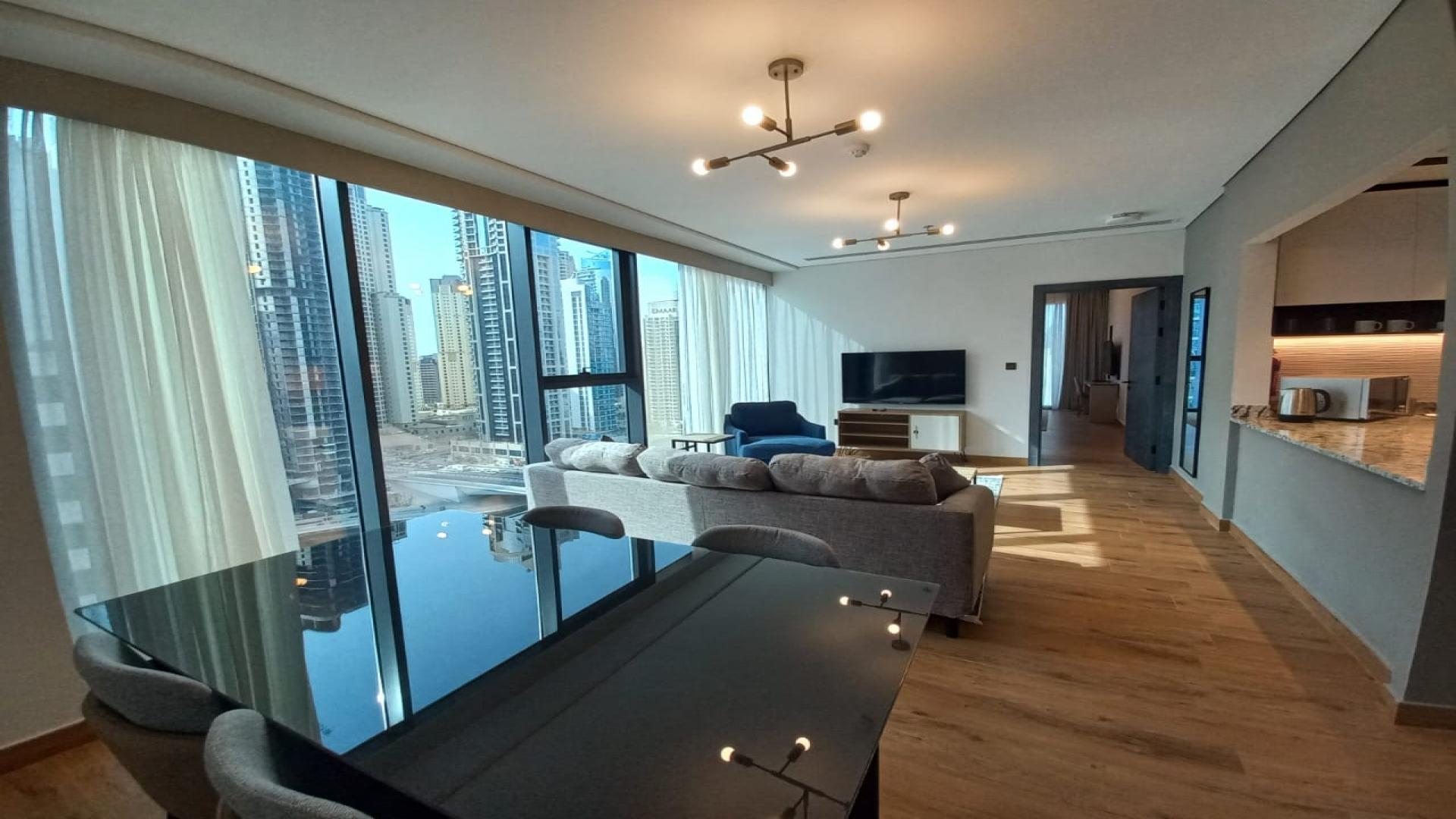 Furnished apartment living room with marina view in Dubai Marina Moon, available for rent
