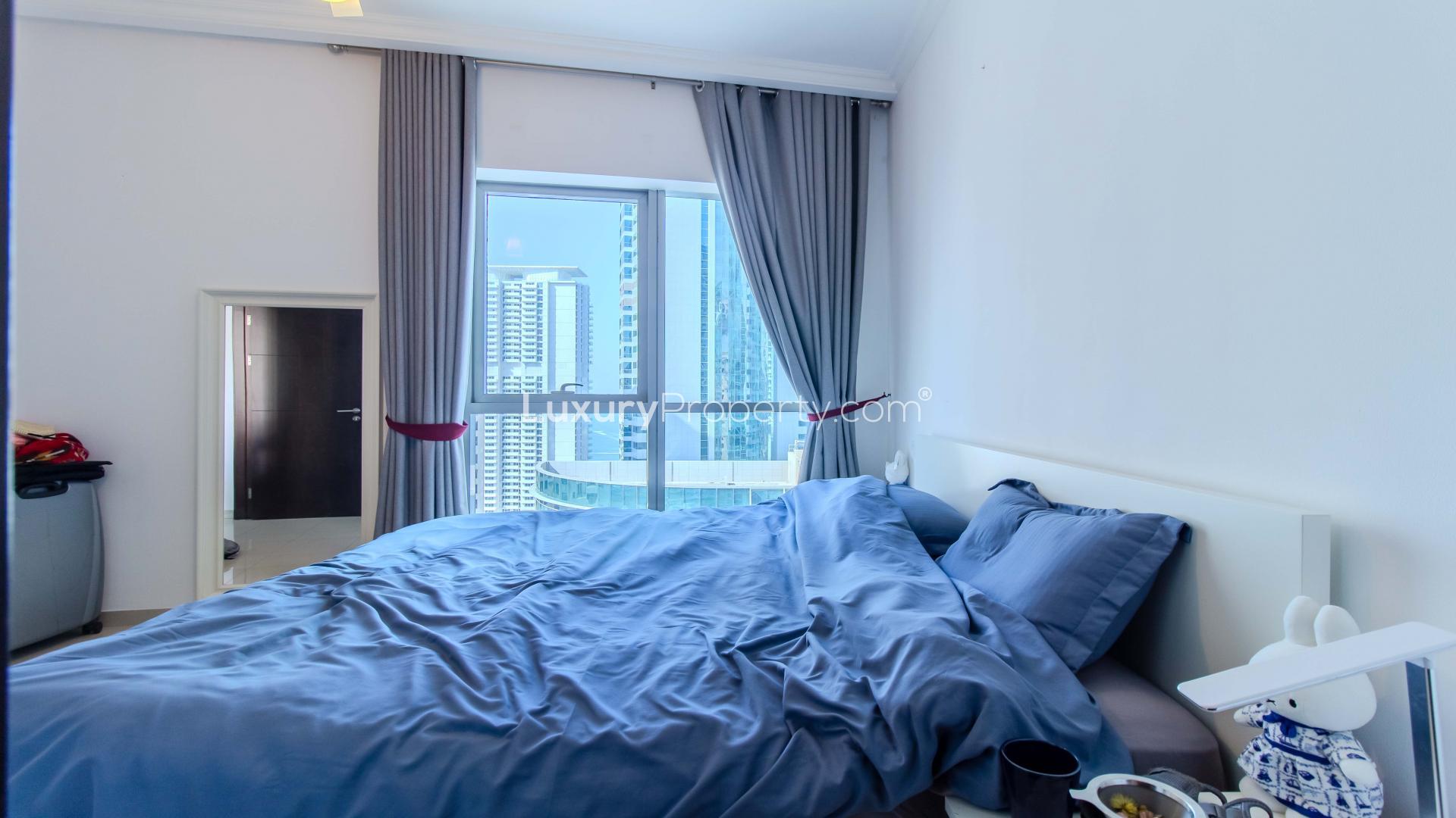 Modern bathroom in Bay Central West apartment, Dubai Marina, featuring sleek fixtures and granite countertop