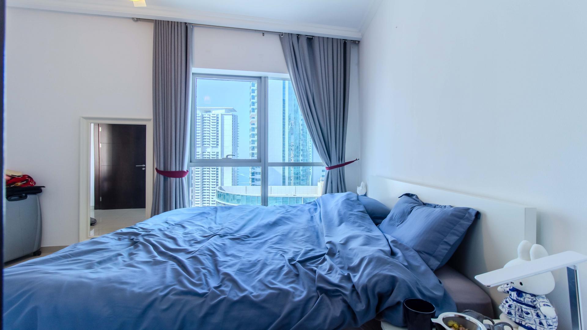 Modern bathroom in Bay Central West apartment, Dubai Marina, featuring sleek fixtures and granite countertop