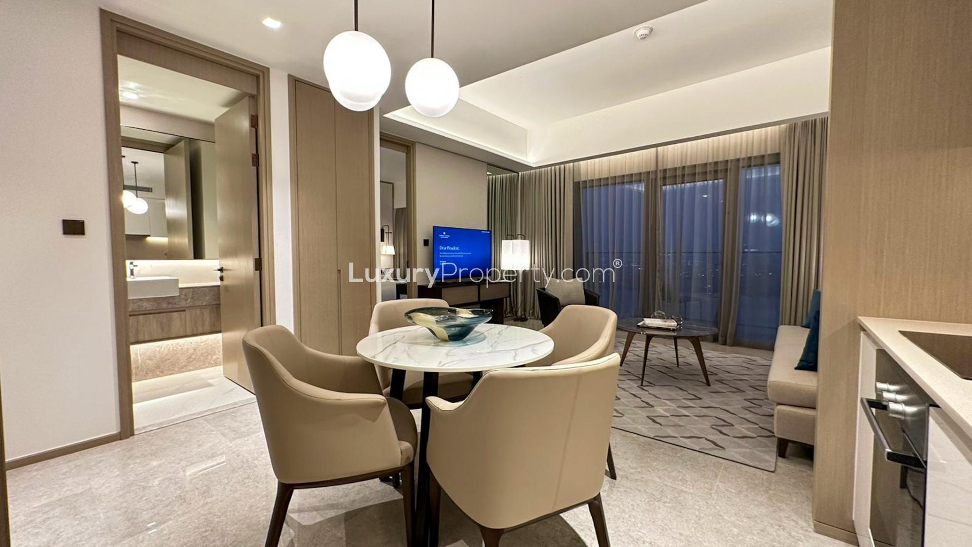 Luxury Dubai Creek Harbour apartment living room with modern kitchen and elegant decor