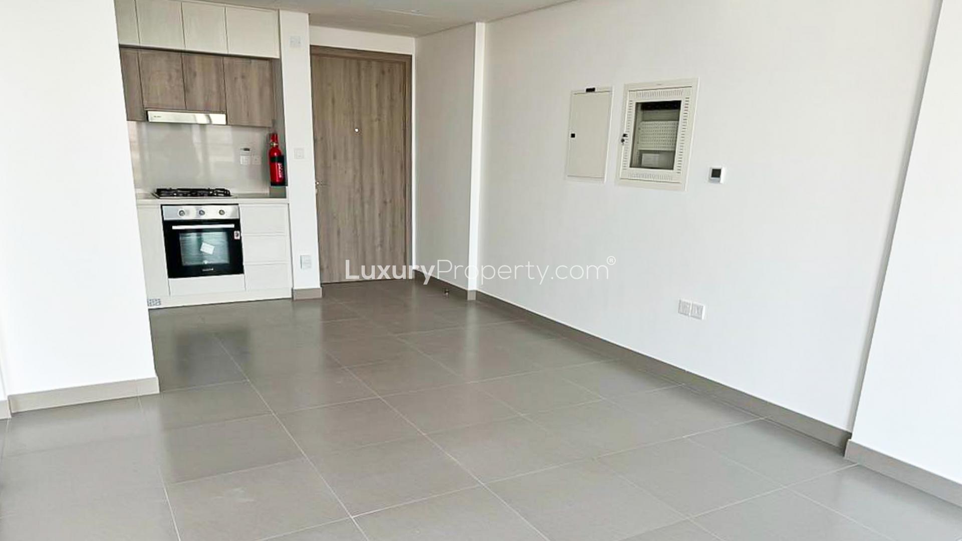 "Spacious balcony view from 1-bed apartment at Prive Residence, Dubai Hills Estate.",Modern kitchen in 1-bed apartment at Prive Residence, Dubai Hills Estate, available for rent