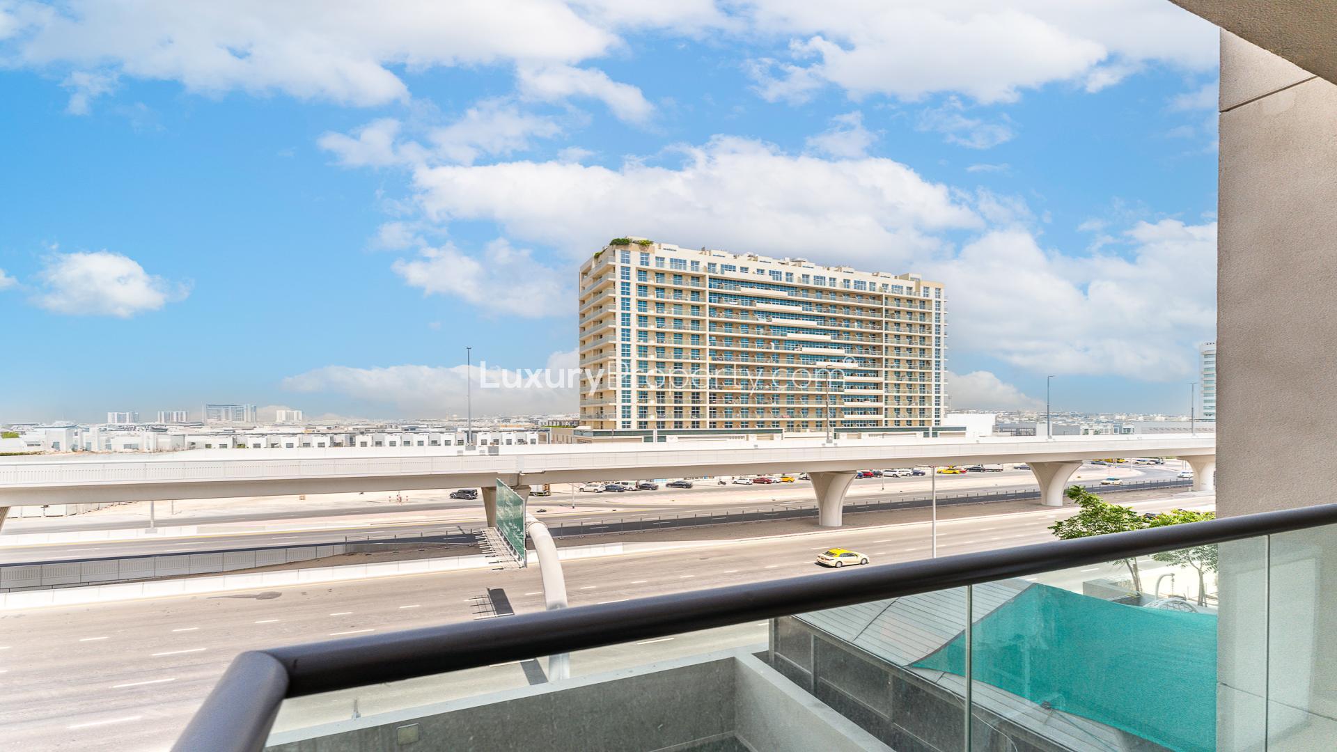 Vacant 1-bed apartment living room with modern decor at East 40, Al Furjan