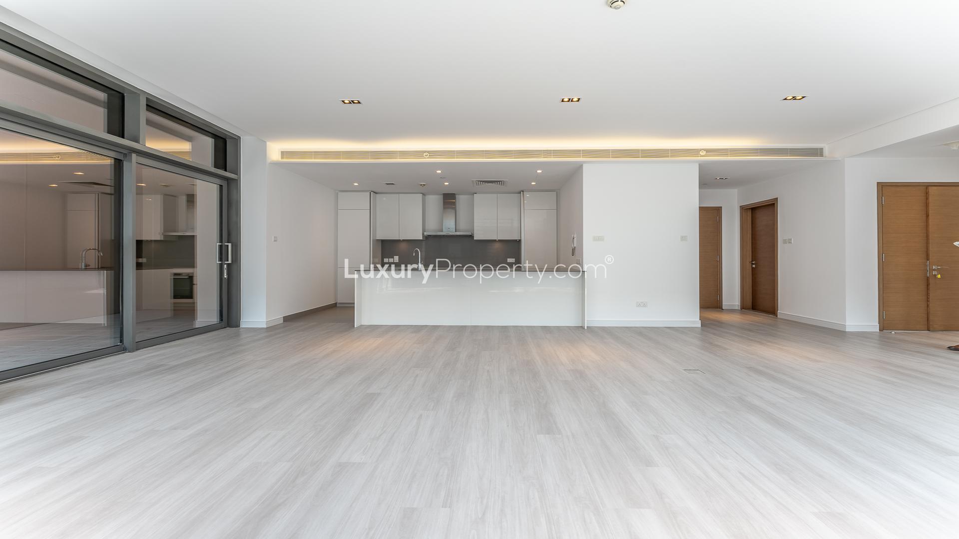 Modern kitchen and living area in City Walk 1-bedroom apartment for rent
