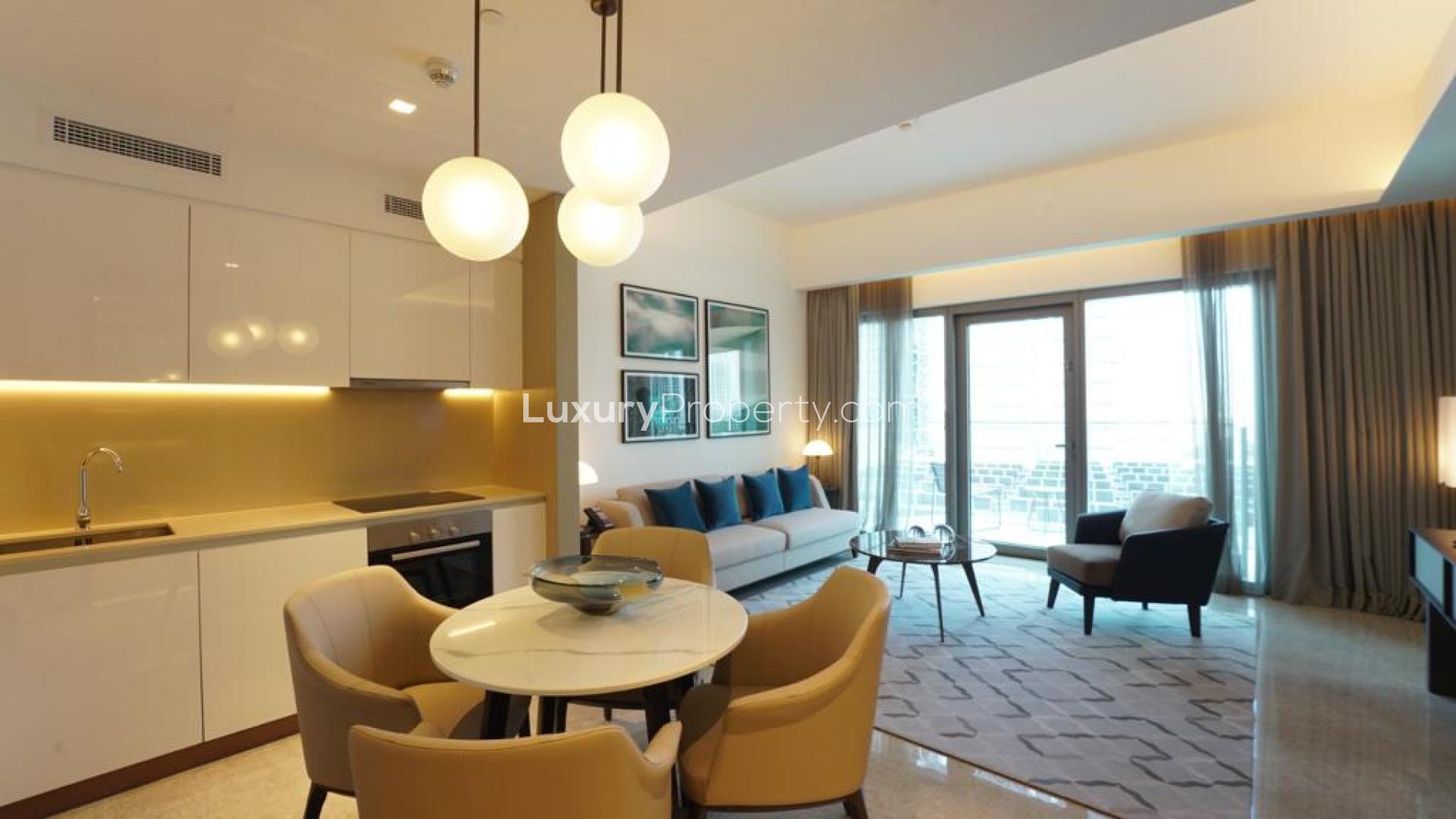 Modern living room and kitchen in Dubai Creek Harbour apartment for rent