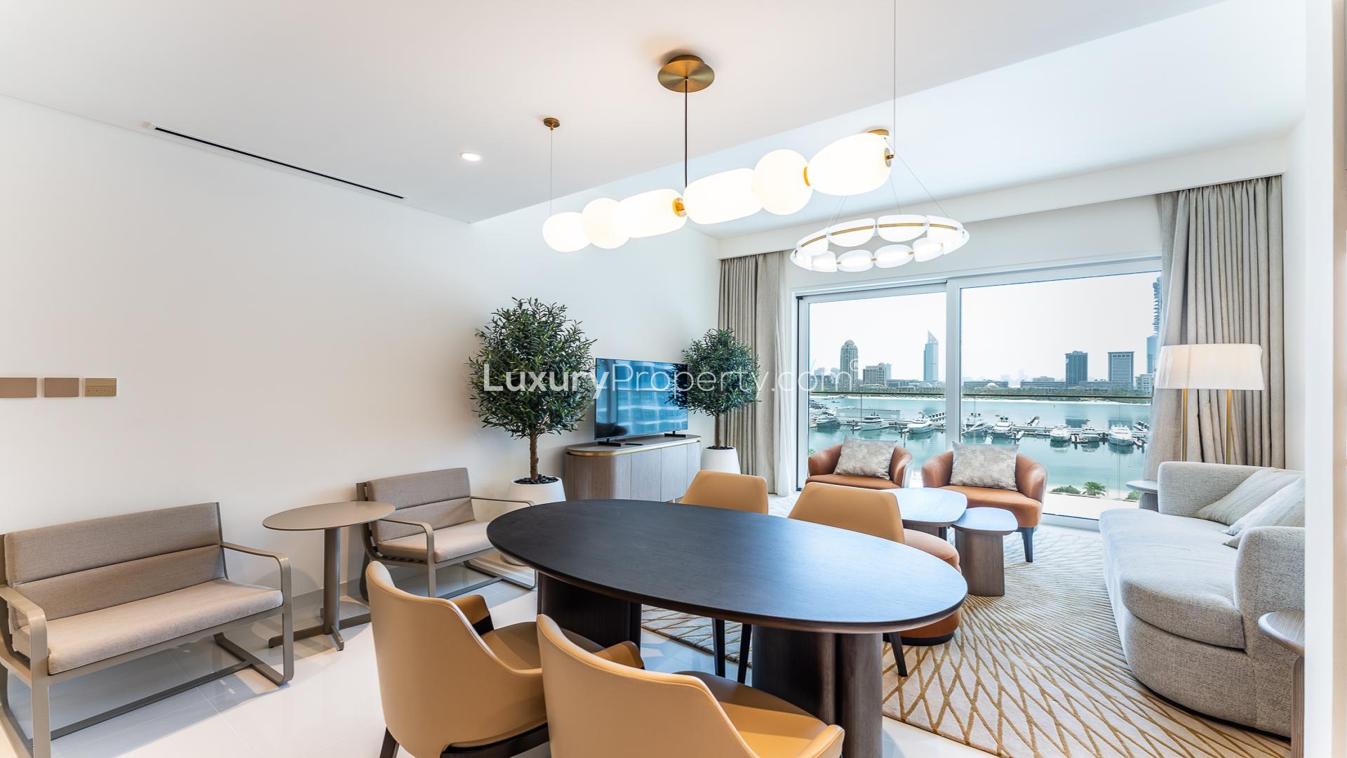 Modern living area in Grand Bleu Tower apartment, Emaar Beachfront, featuring contemporary furniture