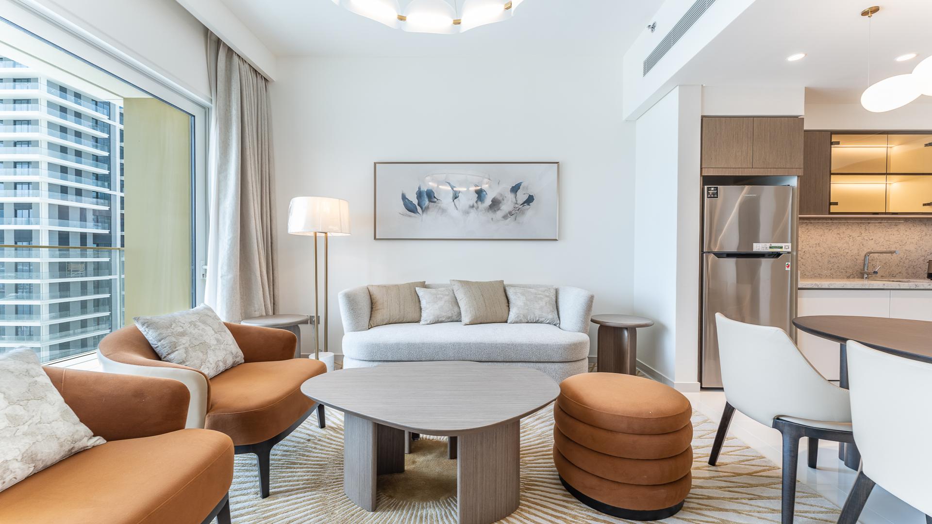 Modern living room and kitchen in Emaar Beachfront apartment, Grand Bleu Tower, for rent