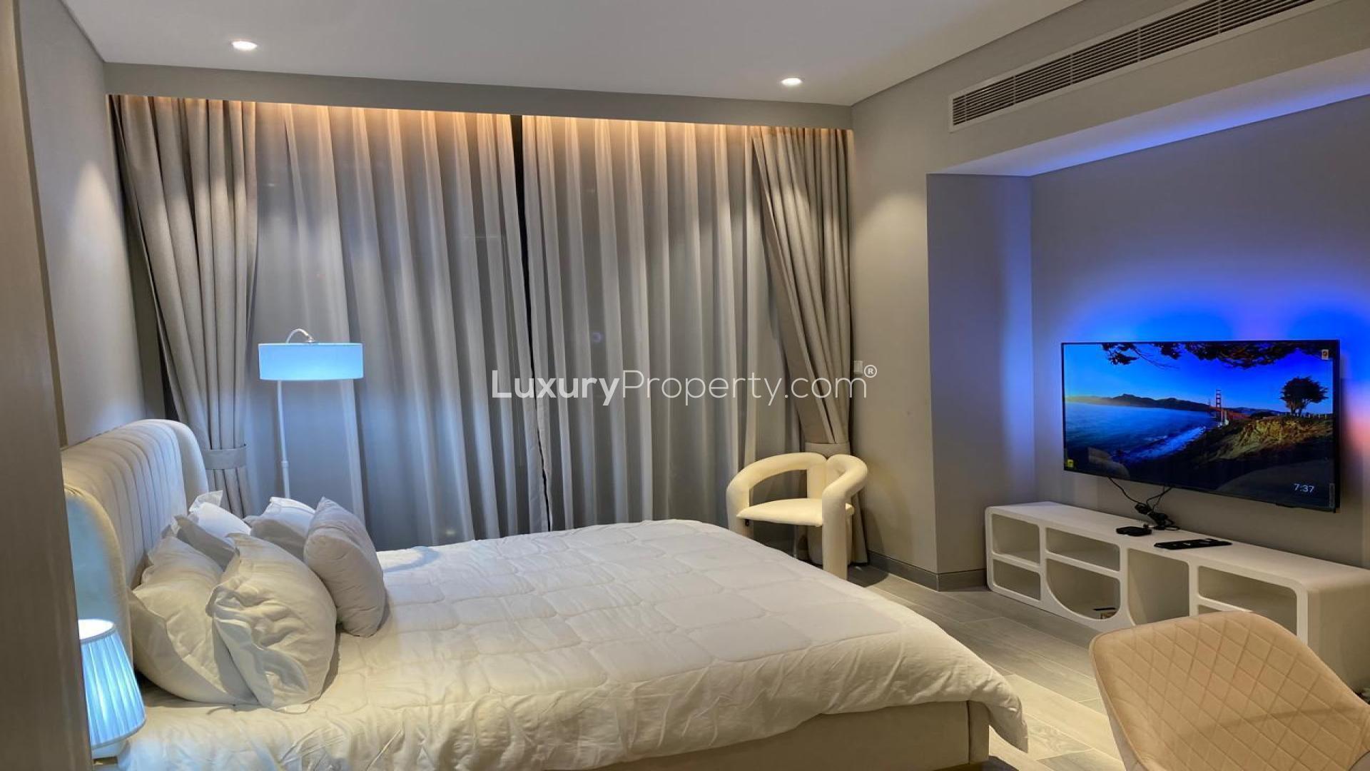 Modern bedroom in Dubai Marina Walk apartment, featuring cozy lighting and elegant decor
