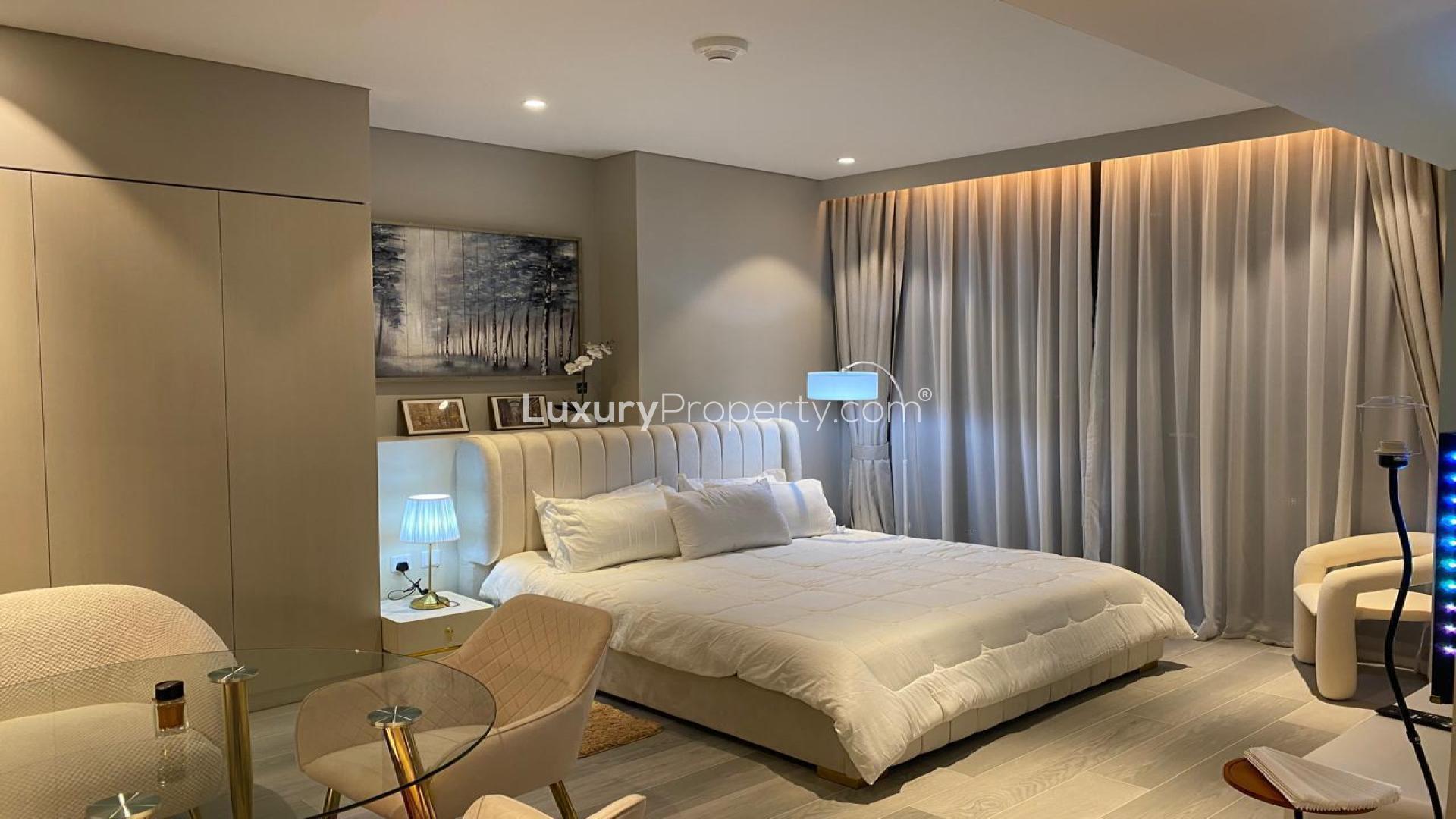 Dubai Marina Walk apartment view with illuminated skyline and waterfront at night