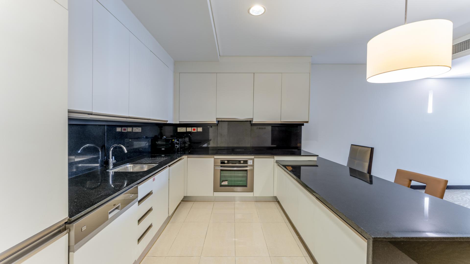 Modern living room in Dubai Marina apartment for rent, featuring city views and stylish decor