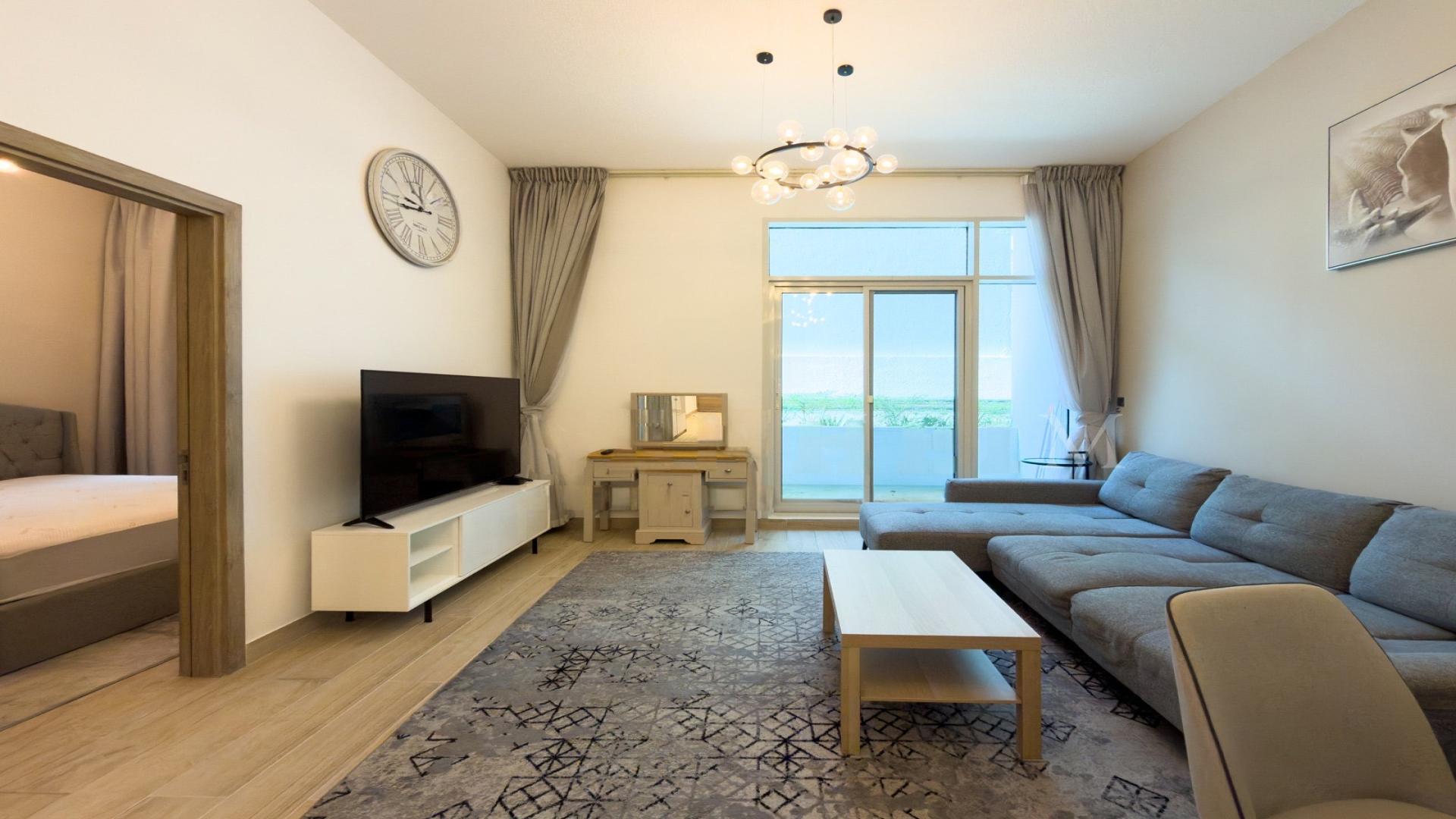 Modern living room in Studio One Tower apartment, Dubai Marina, featuring stylish furniture