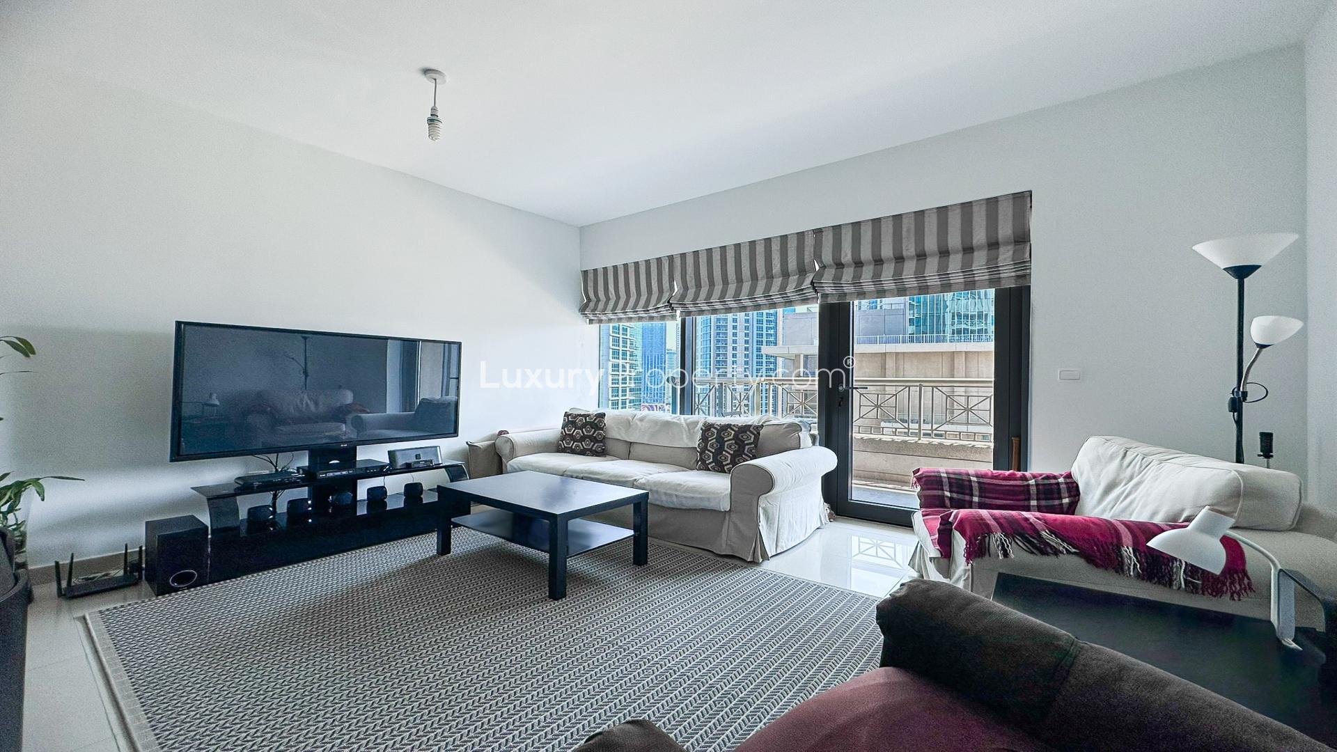High-floor Downtown Dubai apartment living room with modern furnishings and city view