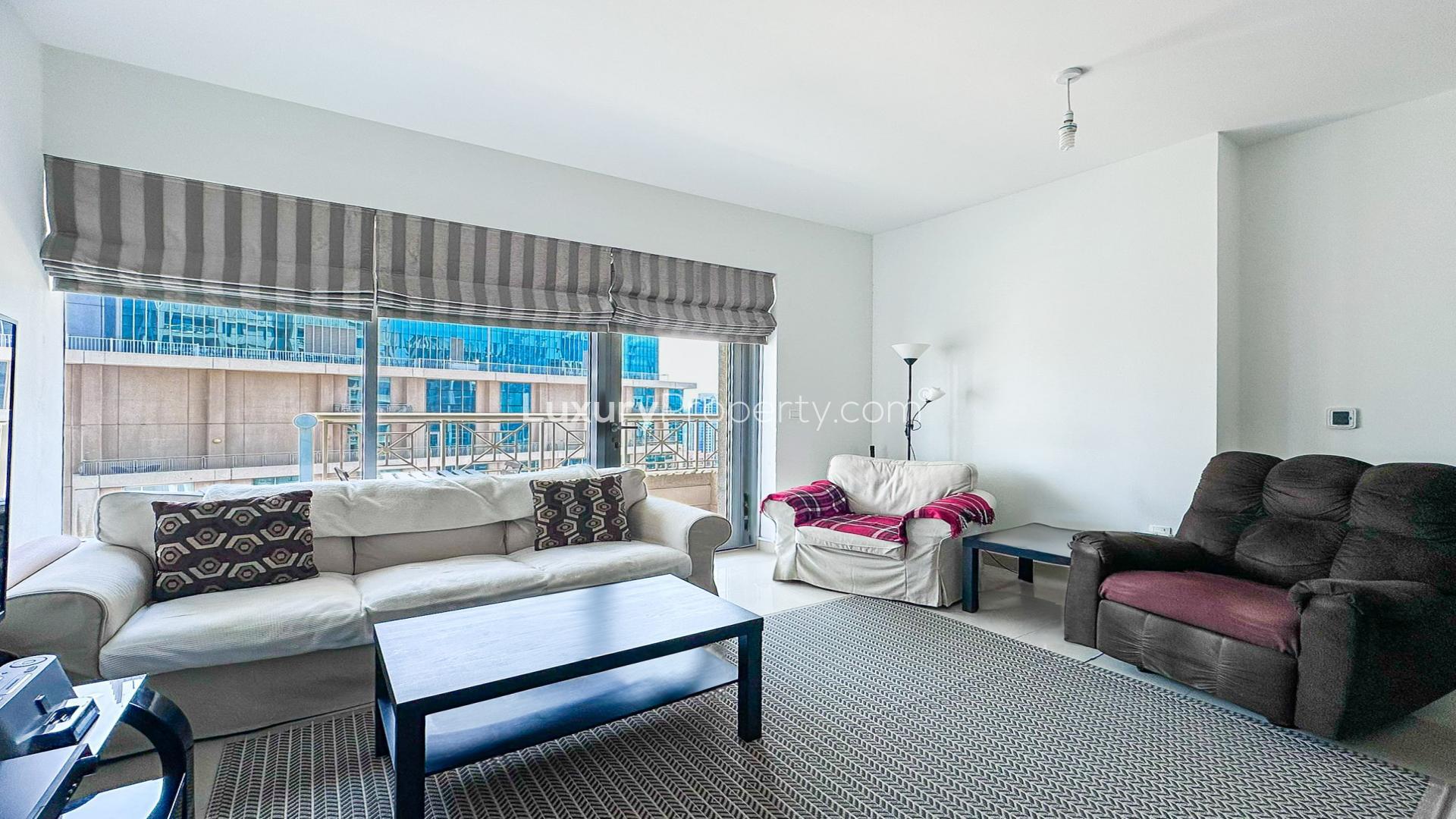 Fully furnished living room with city view in Downtown Dubai apartment, 29 Boulevard