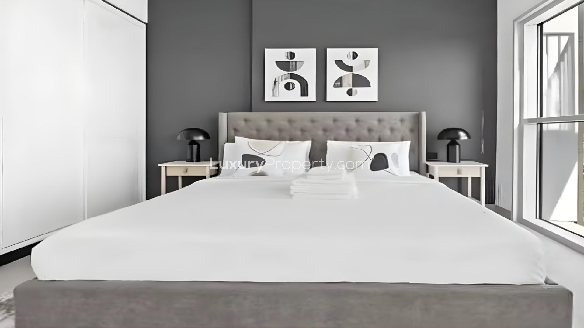 Fully furnished bedroom with modern decor in Collective Tower 1, Dubai Hills Estate