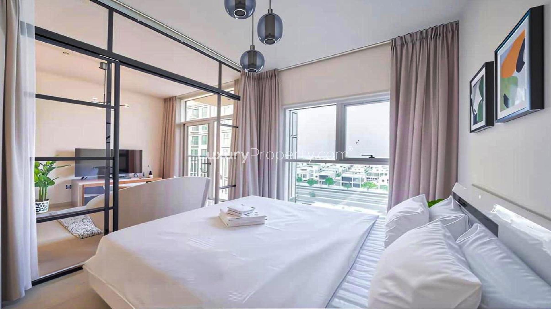 Modern living room in Dubai Hill Estate apartment, featuring sleek decor and open layout