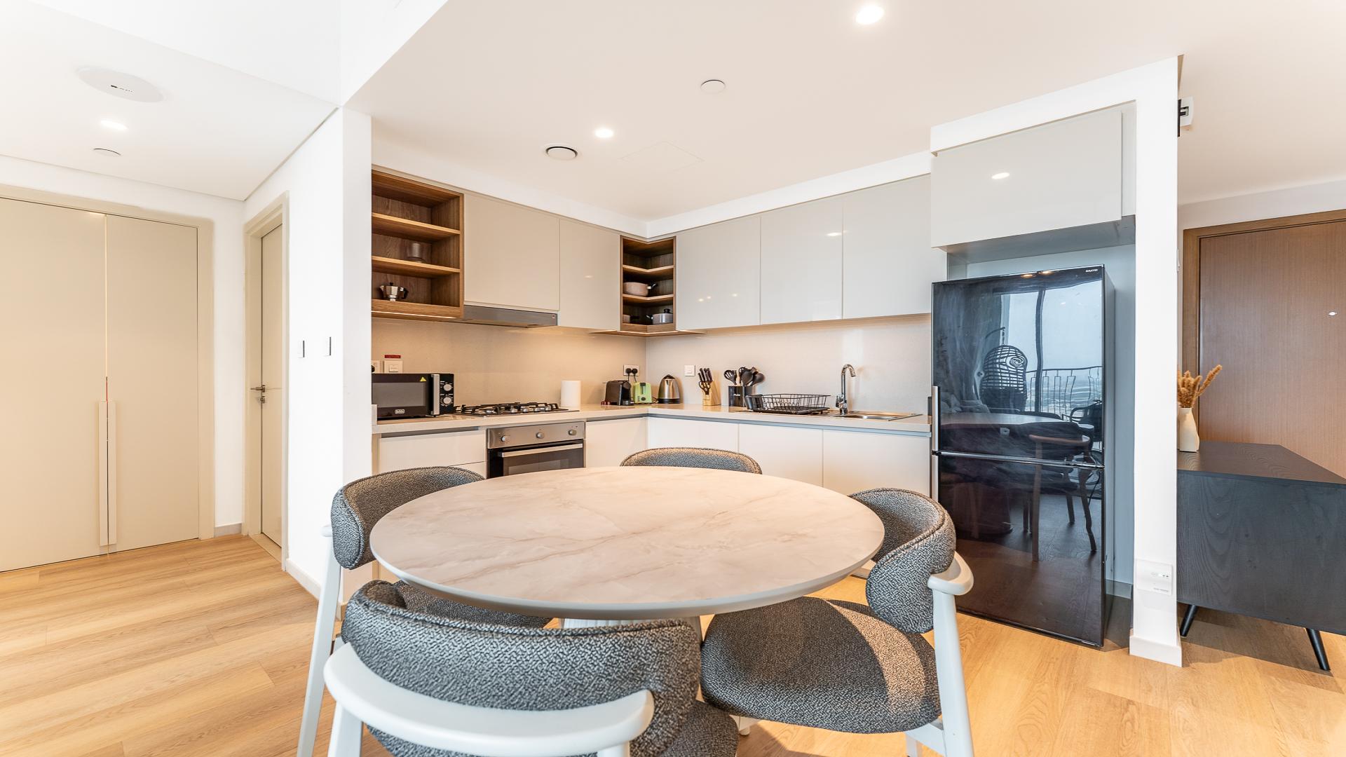 Modern living room with balcony view in Downtown Views II, Downtown Dubai apartment