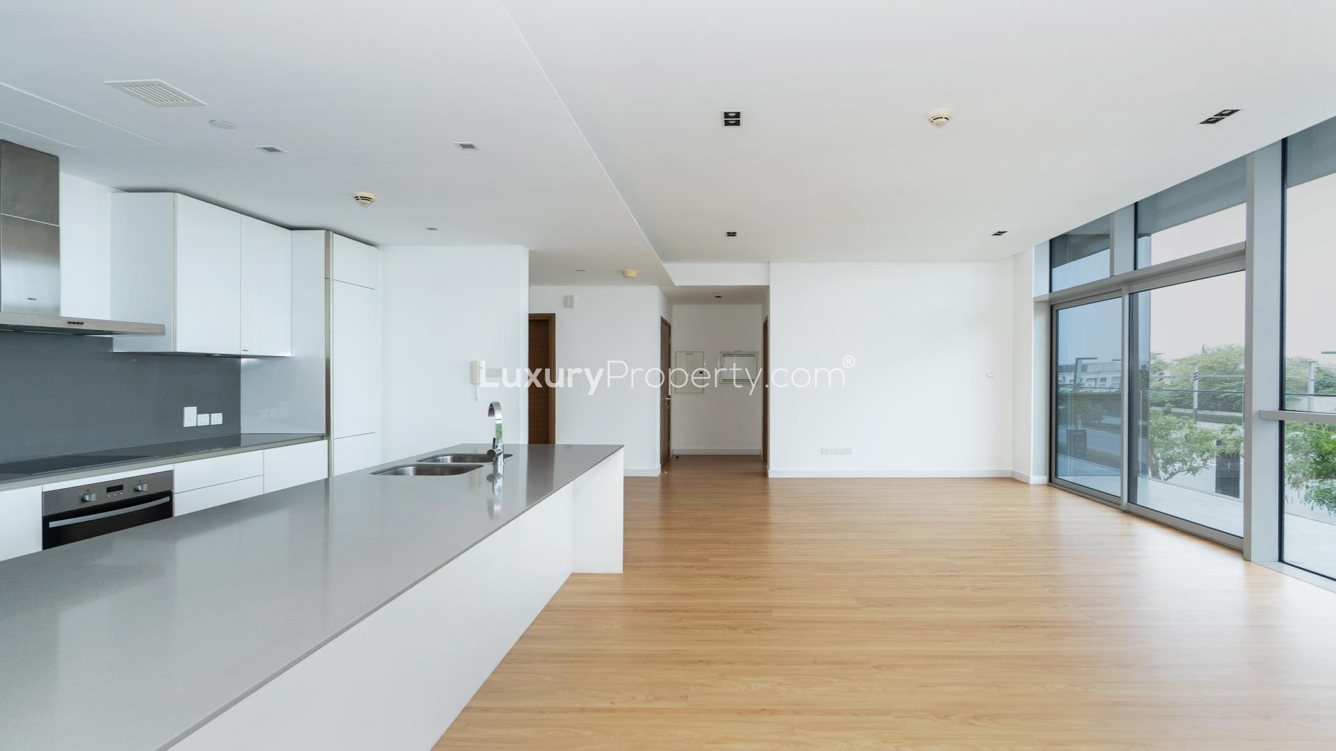 Modern open-plan kitchen and living area in City Walk apartment for rent