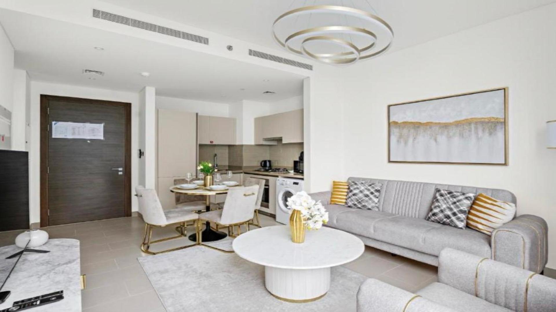 Modern Sobha Creek Vistas Reserve apartment interior with kitchen, dining area, and large windows
