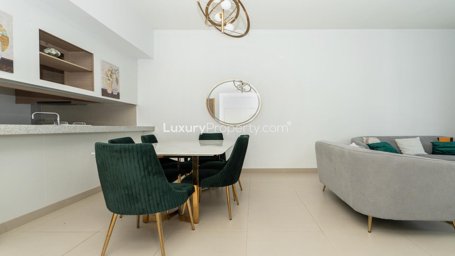 "Modern furnished living-dining area in Dubai Hills Estate apartment with stylish decor and seating.",Dubai Hills Estate Acacia B apartment with pool view, available for rent, fully furnished