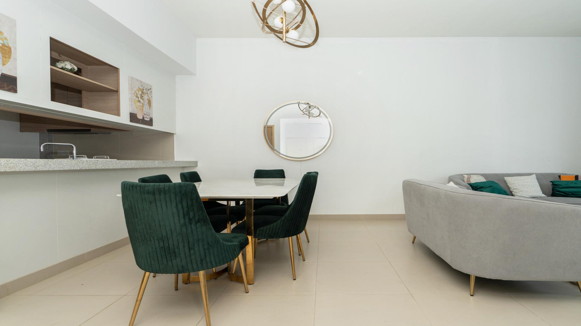 "Modern furnished living-dining area in Dubai Hills Estate apartment with stylish decor and seating.",Dubai Hills Estate Acacia B apartment with pool view, available for rent, fully furnished