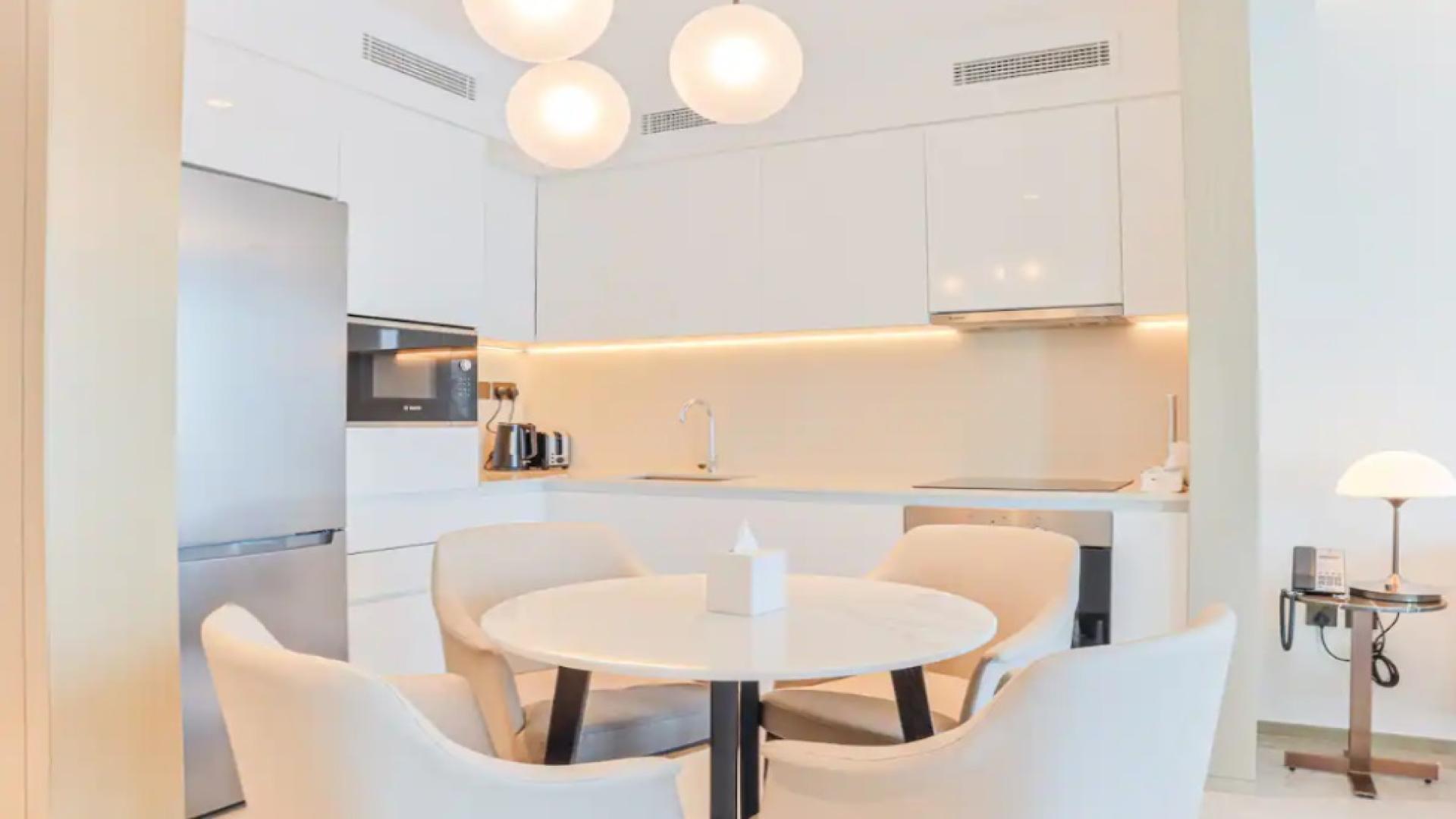 Modern living room with city view in Creek Beach apartment, Address Residences Dubai Creek Harbour