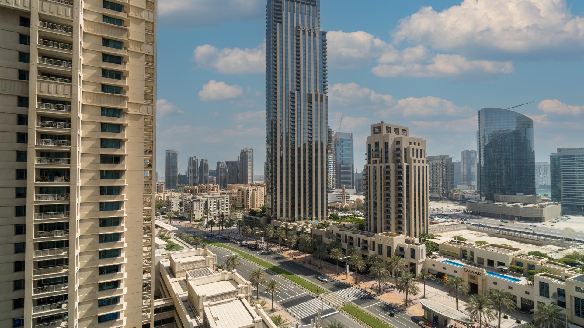 Mid-floor apartment interior with open kitchen in 29 Burj Boulevard, Downtown Dubai