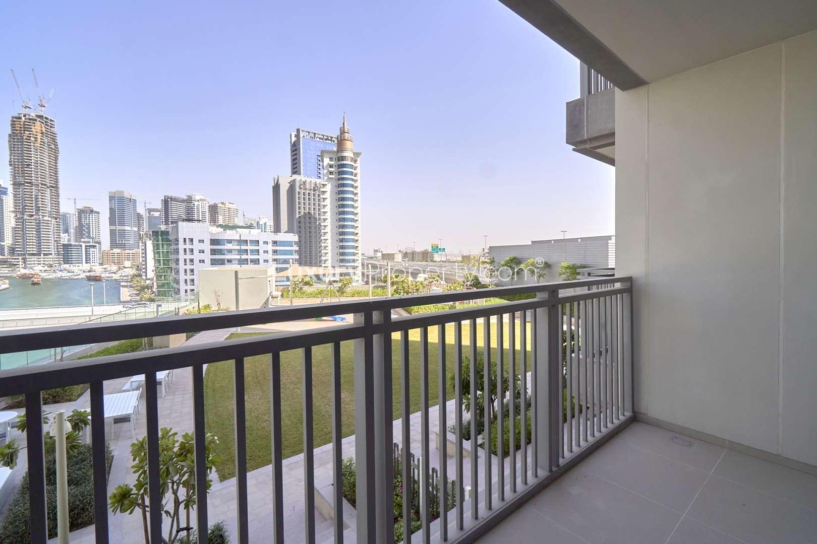 Waterfront view from 1-bedroom apartment in 52|42, Dubai Marina, showcasing skyline and canal
