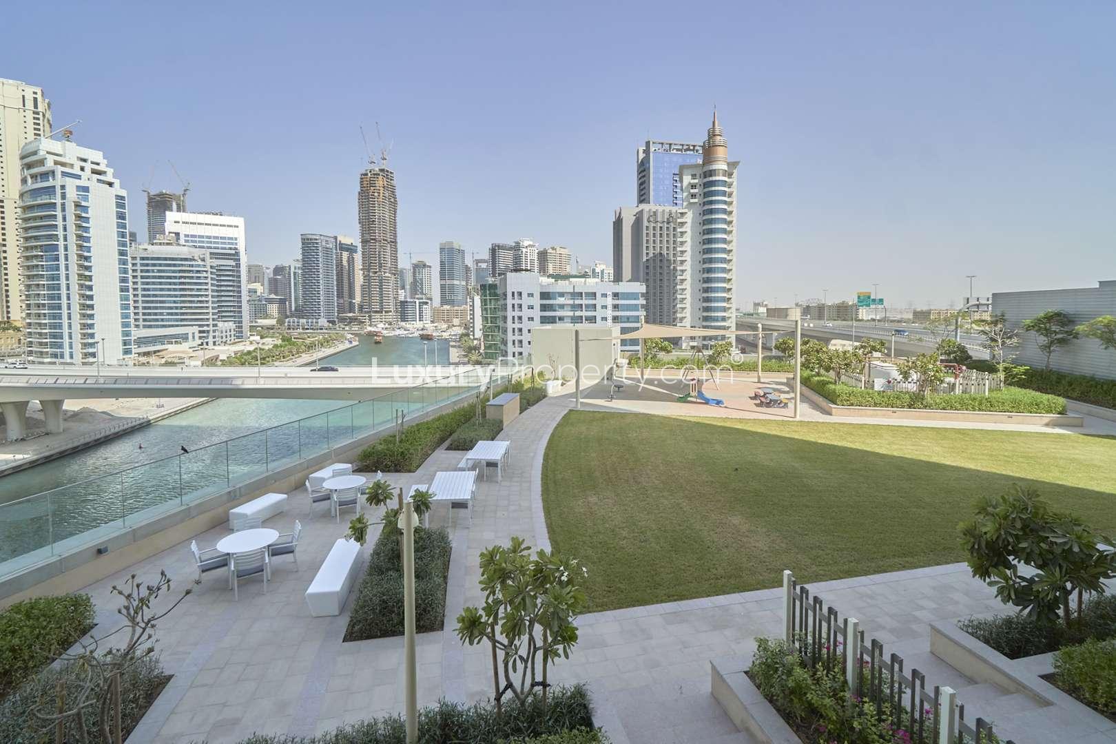 Modern waterfront apartment view in 52|42, Dubai Marina with skyline and canal