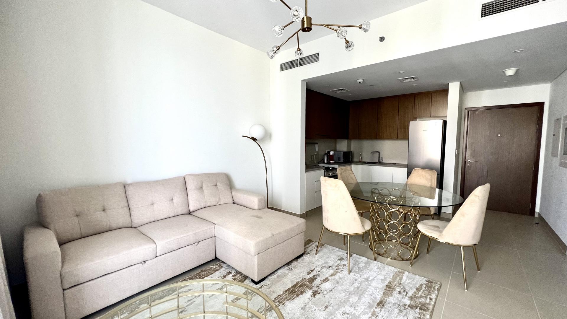 Furnished Dubai Marina apartment kitchen and dining area, modern decor, available for rent