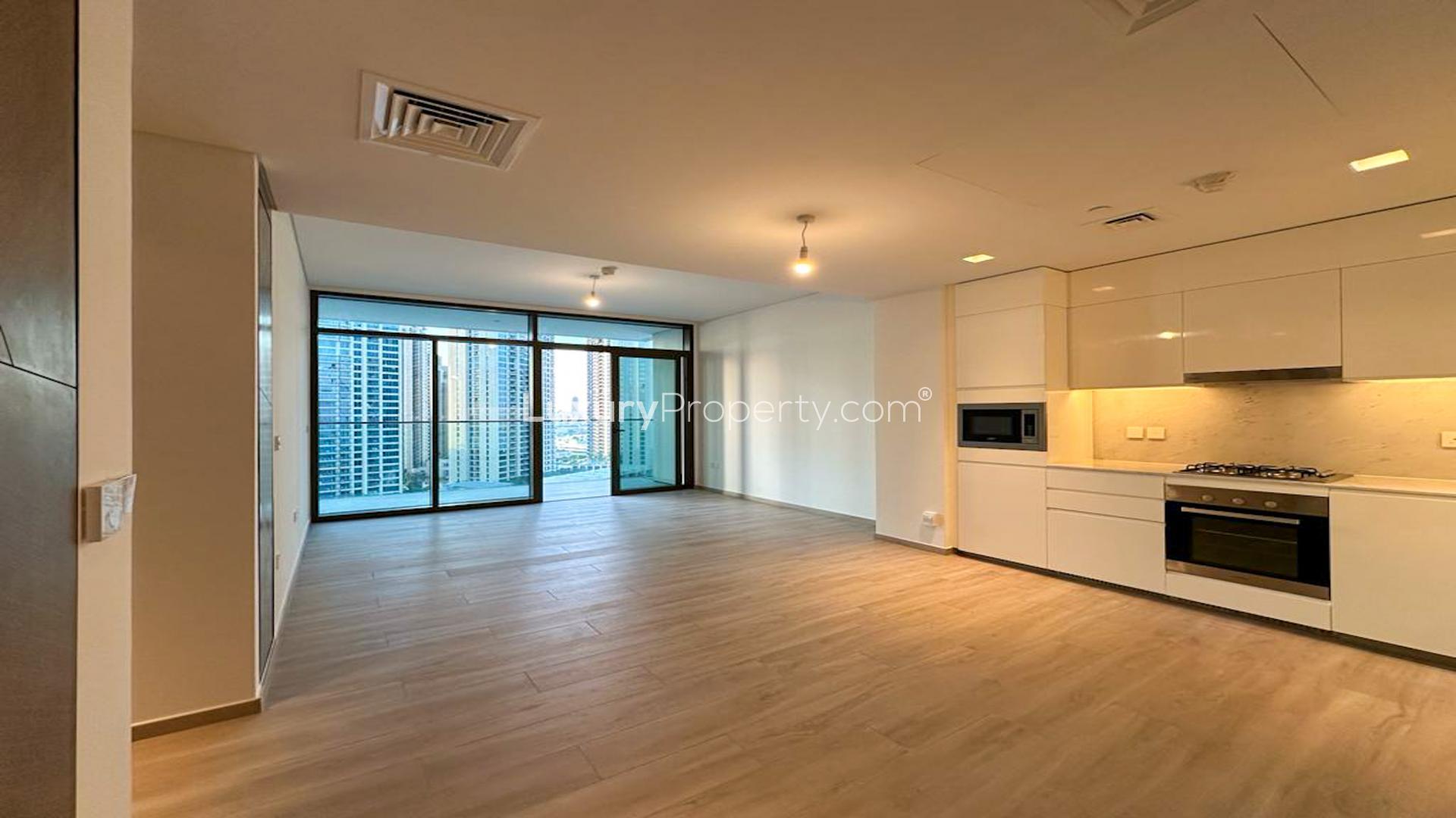 "Stunning Dubai Creek Harbour skyline view from Palace Residences apartment balcony for rent.",Modern kitchen and living area in two-bedroom apartment, Palace Residences, Dubai Creek Harbour