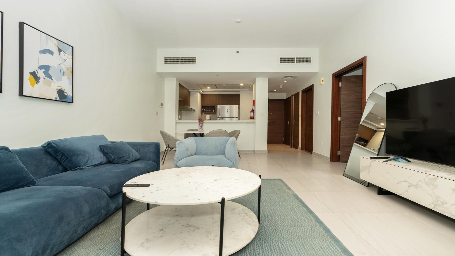 Balcony view of Al Kifaf Park Gate Residences apartment for rent, overlooking green park