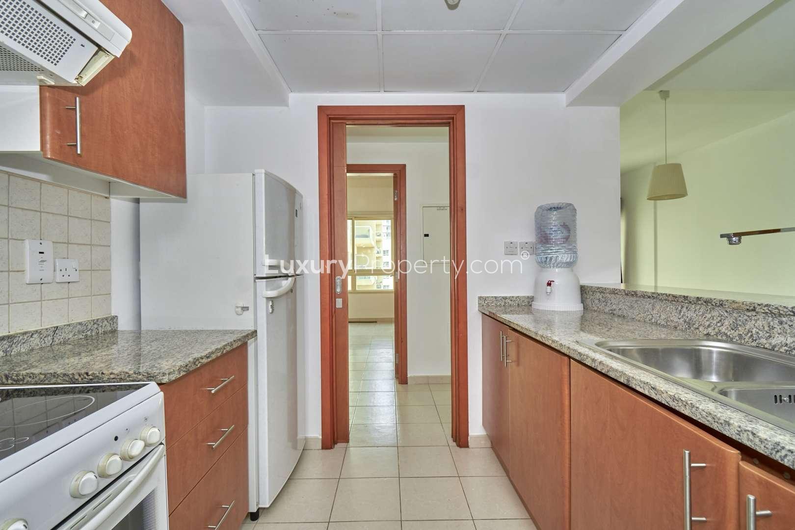 Modern apartment view in Al Gozlan, The Greens, with lush gardens and communal facilities