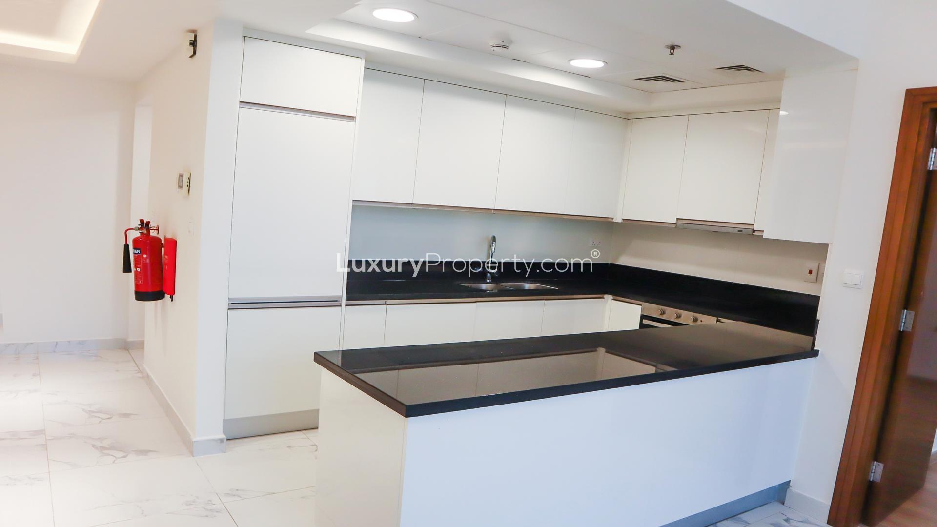 Spacious modern apartment interior with large windows and city views in Al Habtoor City