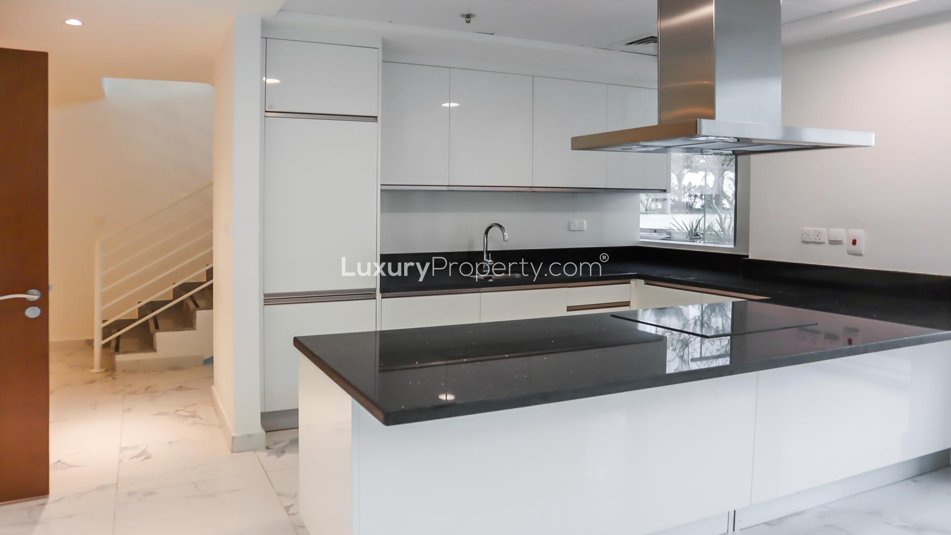 Modern kitchen in 1-bedroom loft, Al Habtoor City, Business Bay, with sleek finishes and large windows