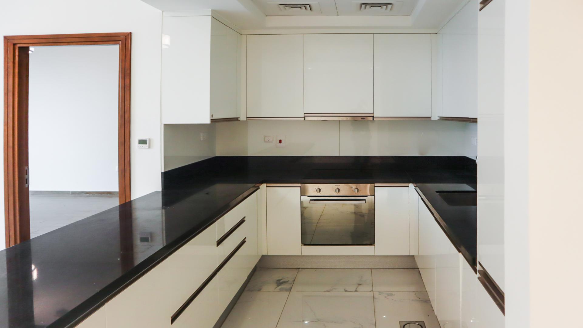 Bright living area with large windows in Al Habtoor City apartment, Business Bay
