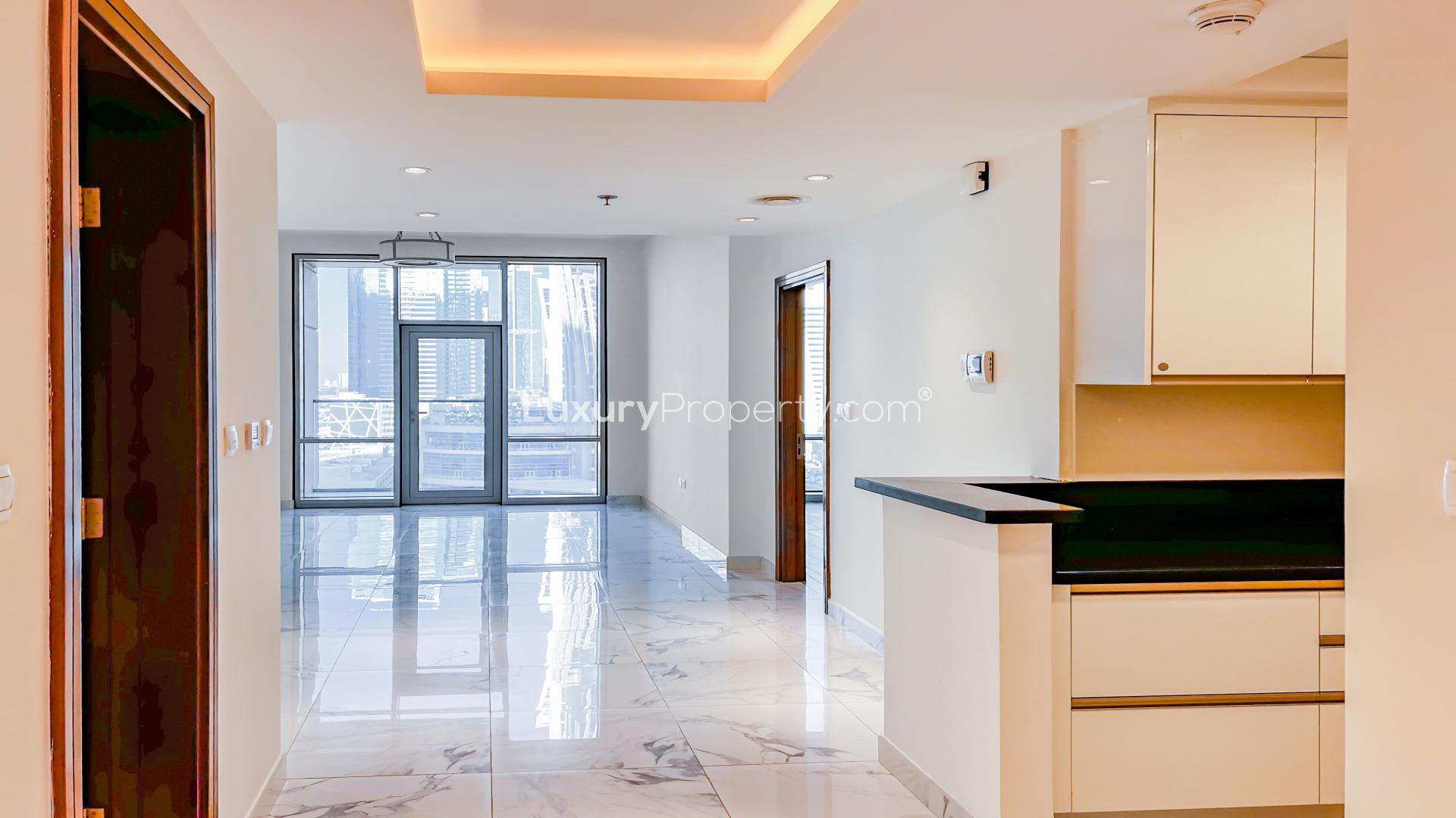 "Spacious apartment with marble floors and canal views in Al Habtoor City, Business Bay.",High-end apartment in Al Habtoor City with canal views, marble floors, and open kitchen