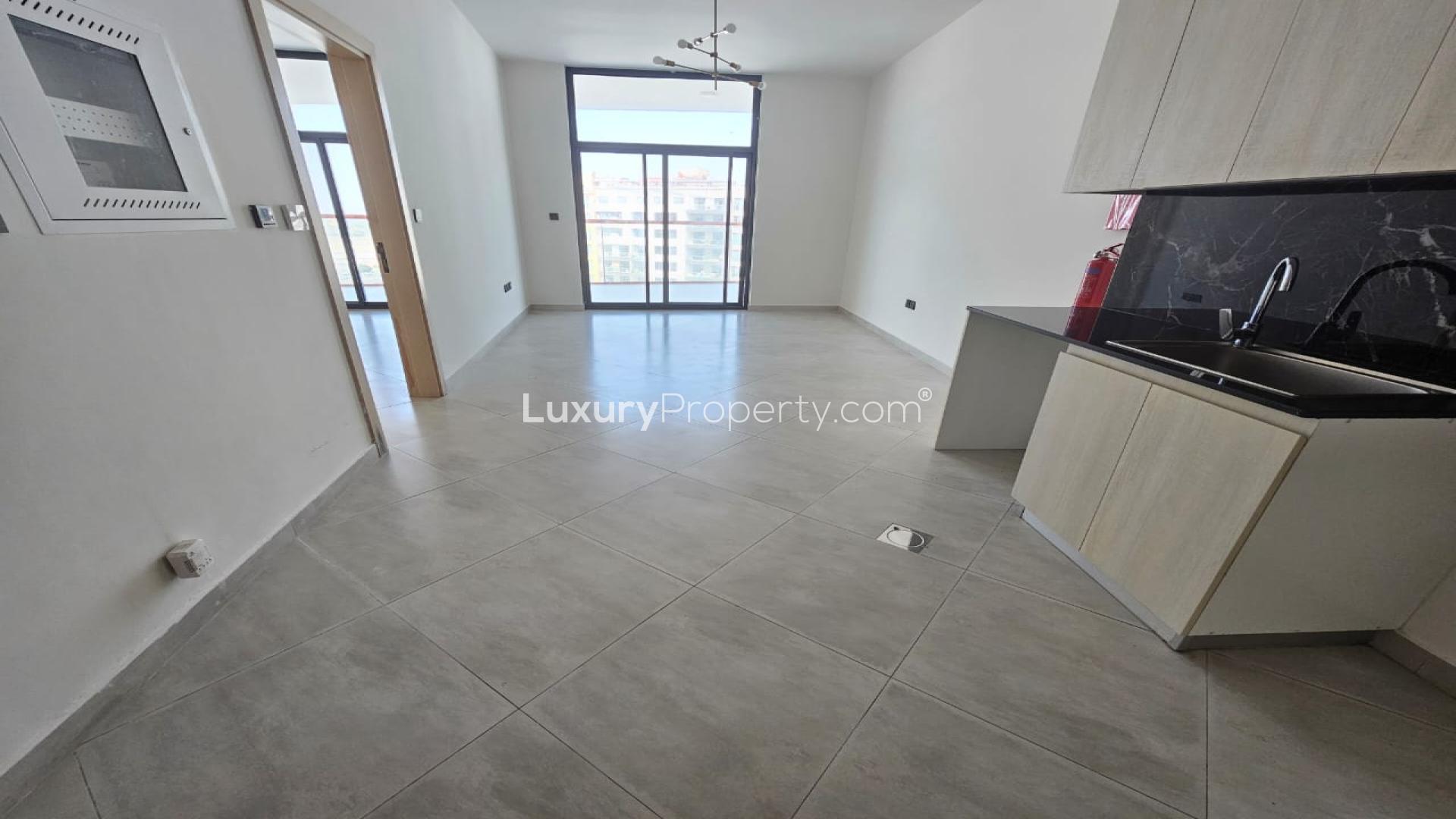 Modern kitchen and living area in Binghatti Avenue apartment, Al Jaddaf, available for rent