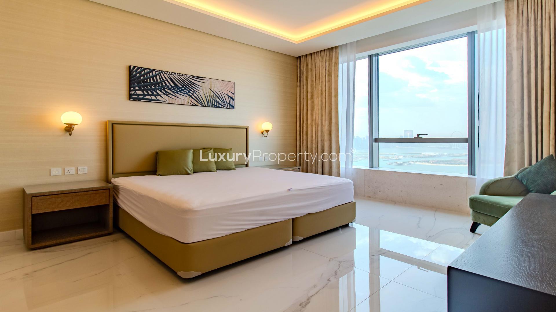 Upgraded Palm Jumeirah apartment living room with sea view, elegant decor, and modern furnishings