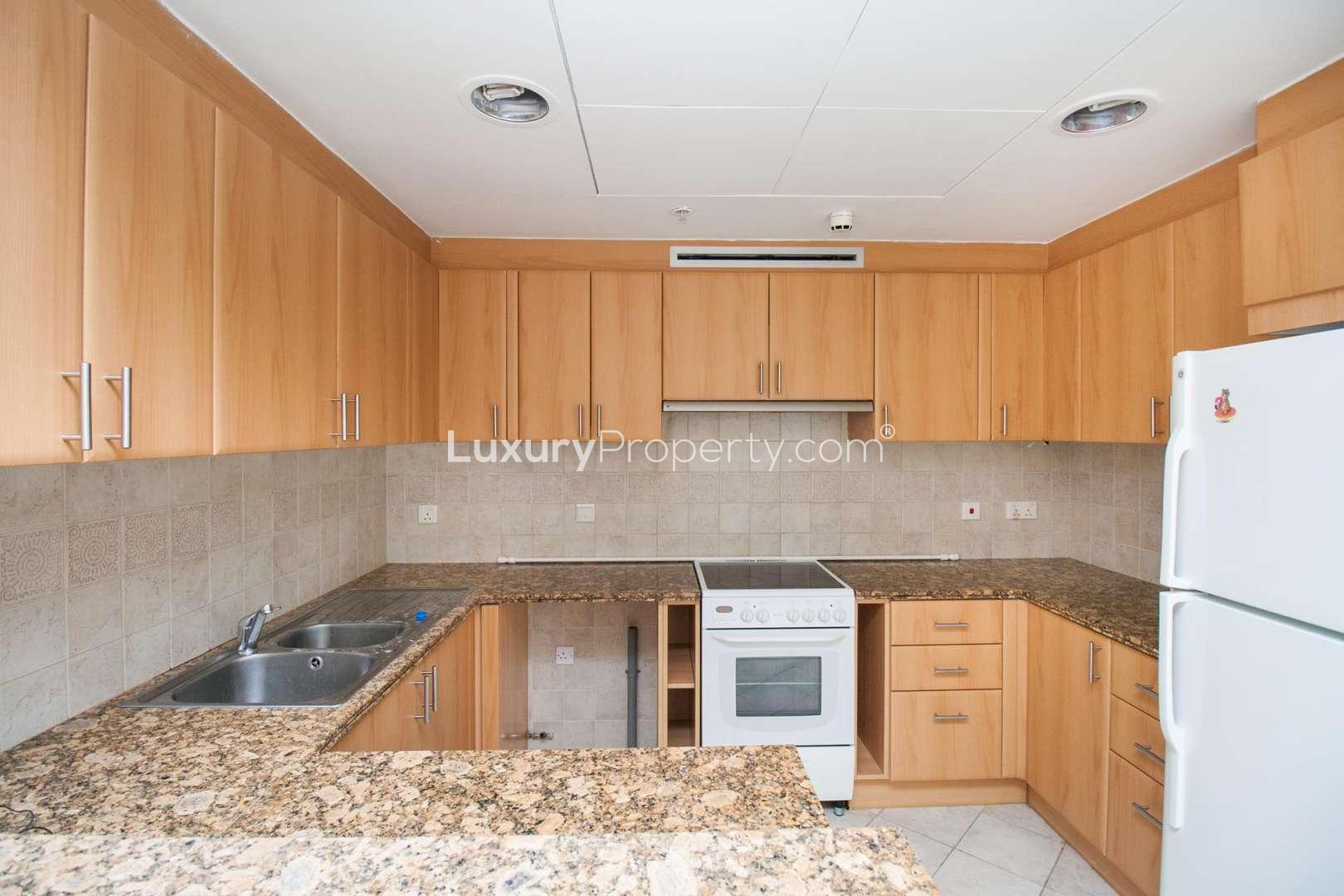 Modern kitchen in luxury one-bedroom apartment, Al Murjan Tower, Dubai Marina, with granite countertops