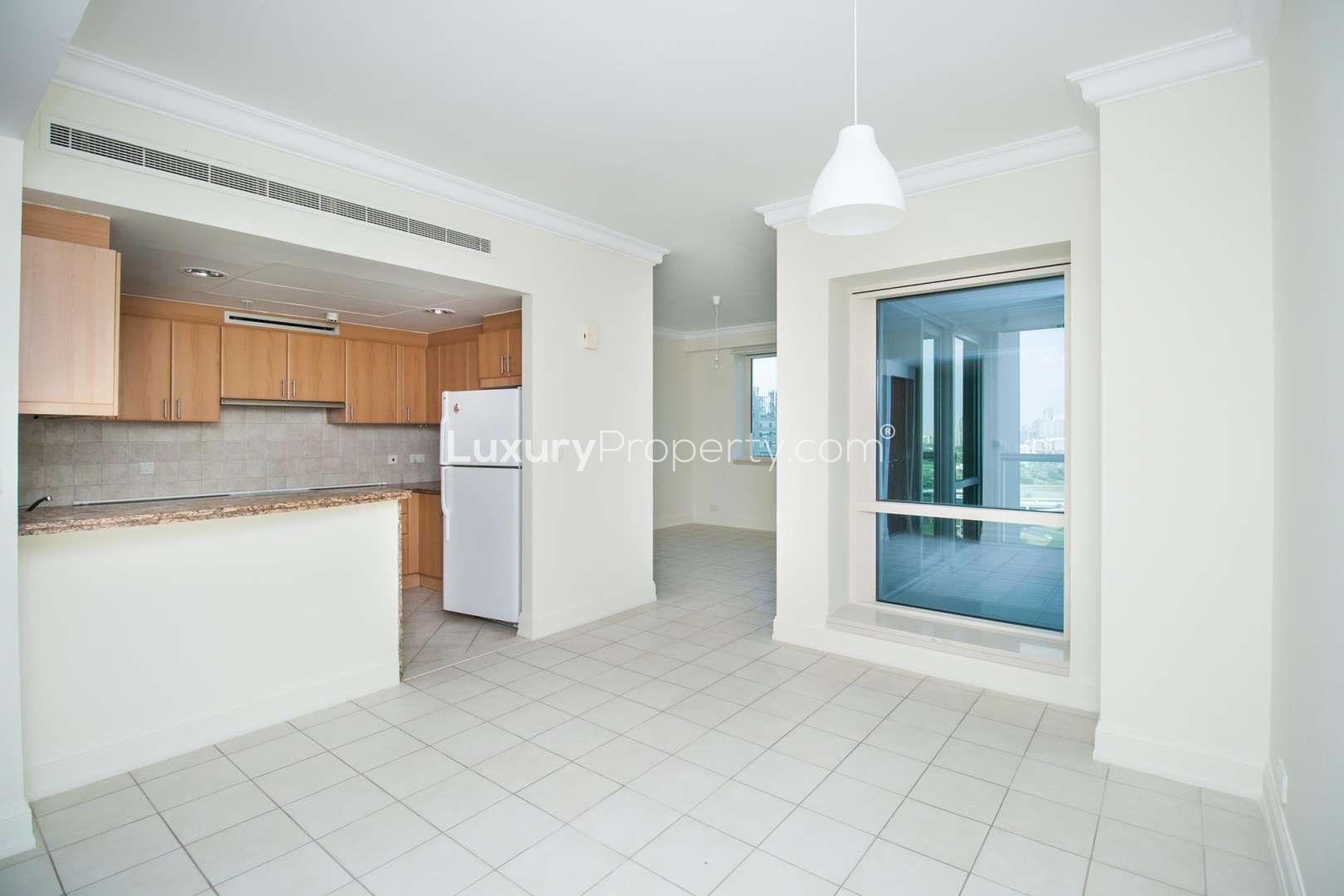 Modern kitchen and dining area in Al Murjan Tower apartment, Dubai Marina
