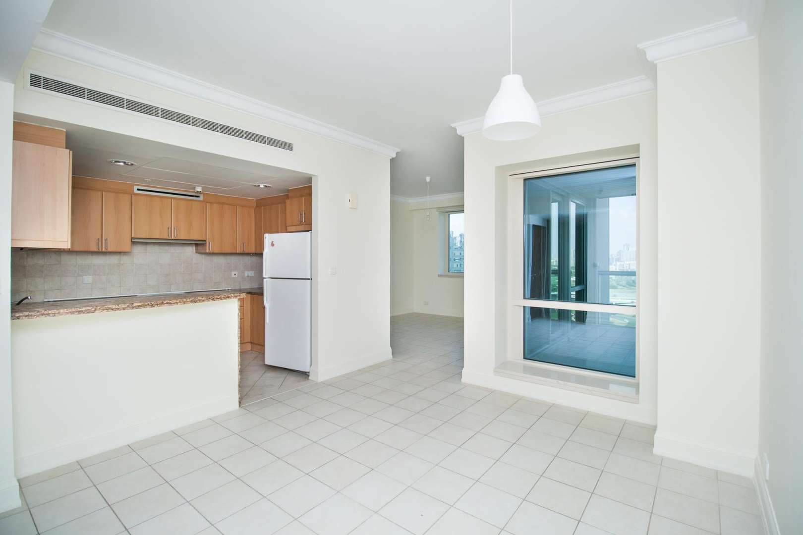 Modern kitchen and dining area in Al Murjan Tower apartment, Dubai Marina