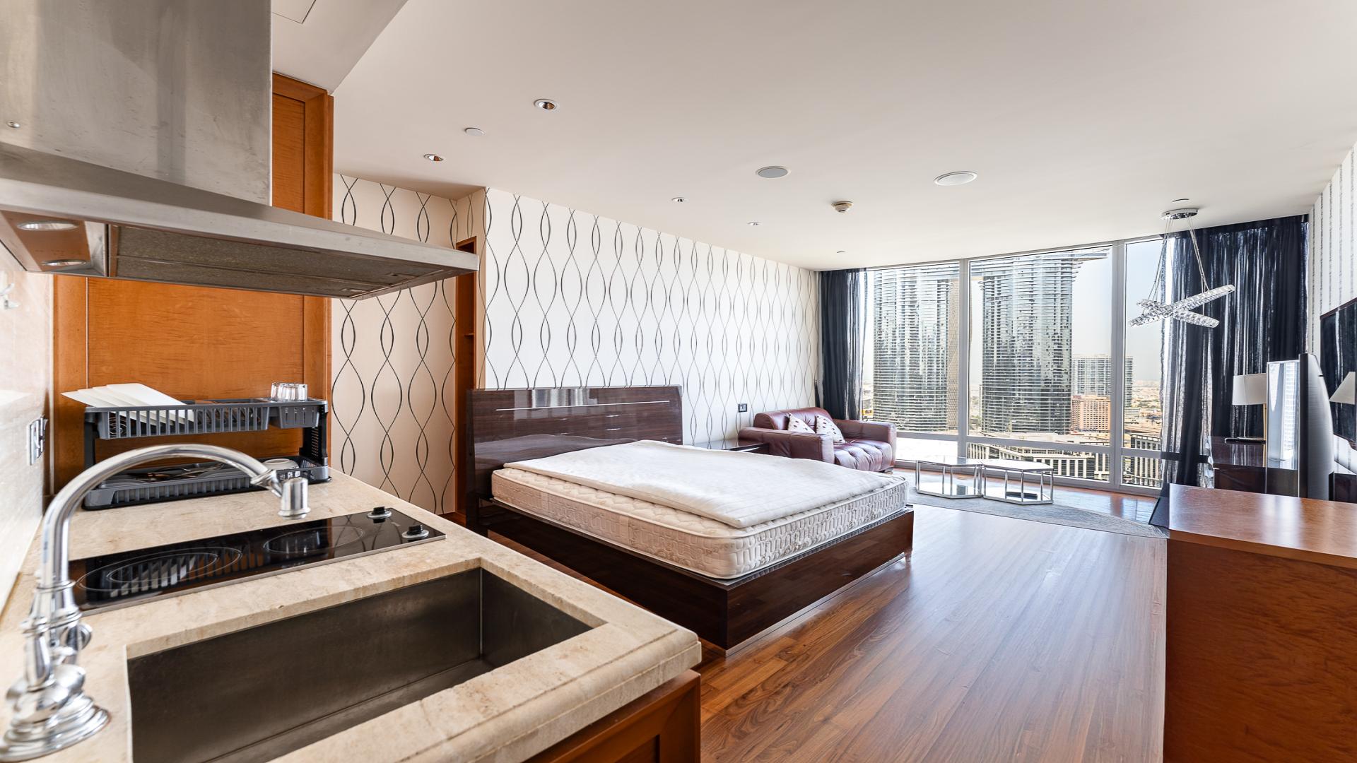 Studio apartment view of Downtown Dubai skyline from Burj Khalifa, featuring DIFC and Sheikh Zayed