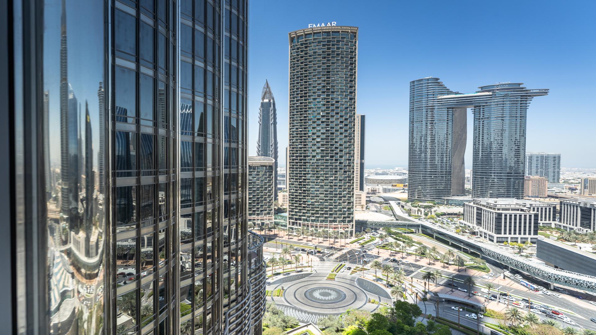 Studio apartment interior with DIFC and Sheikh Zayed Road views through large windows