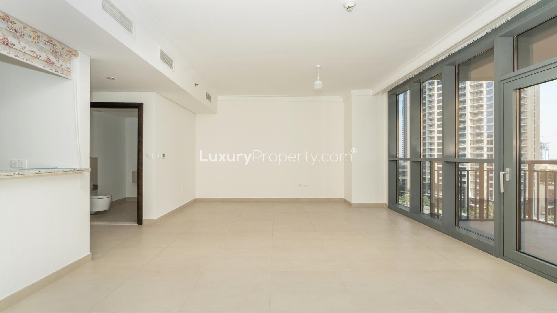 Modern living room in Dubai Creek Harbour apartment, featuring stylish decor and balcony view