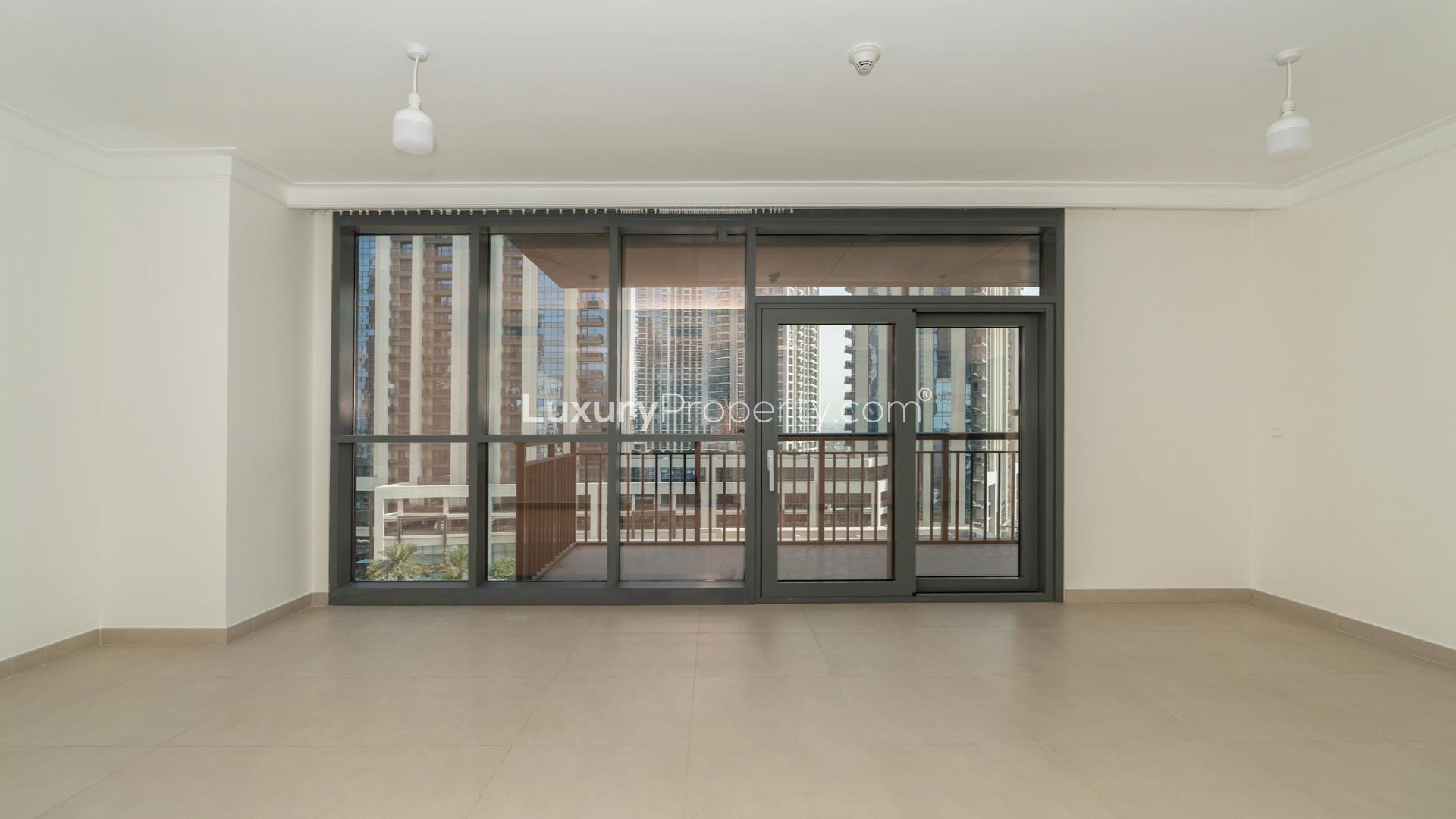 Modern living room in Dubai Creek Harbour apartment, featuring stylish decor and balcony view