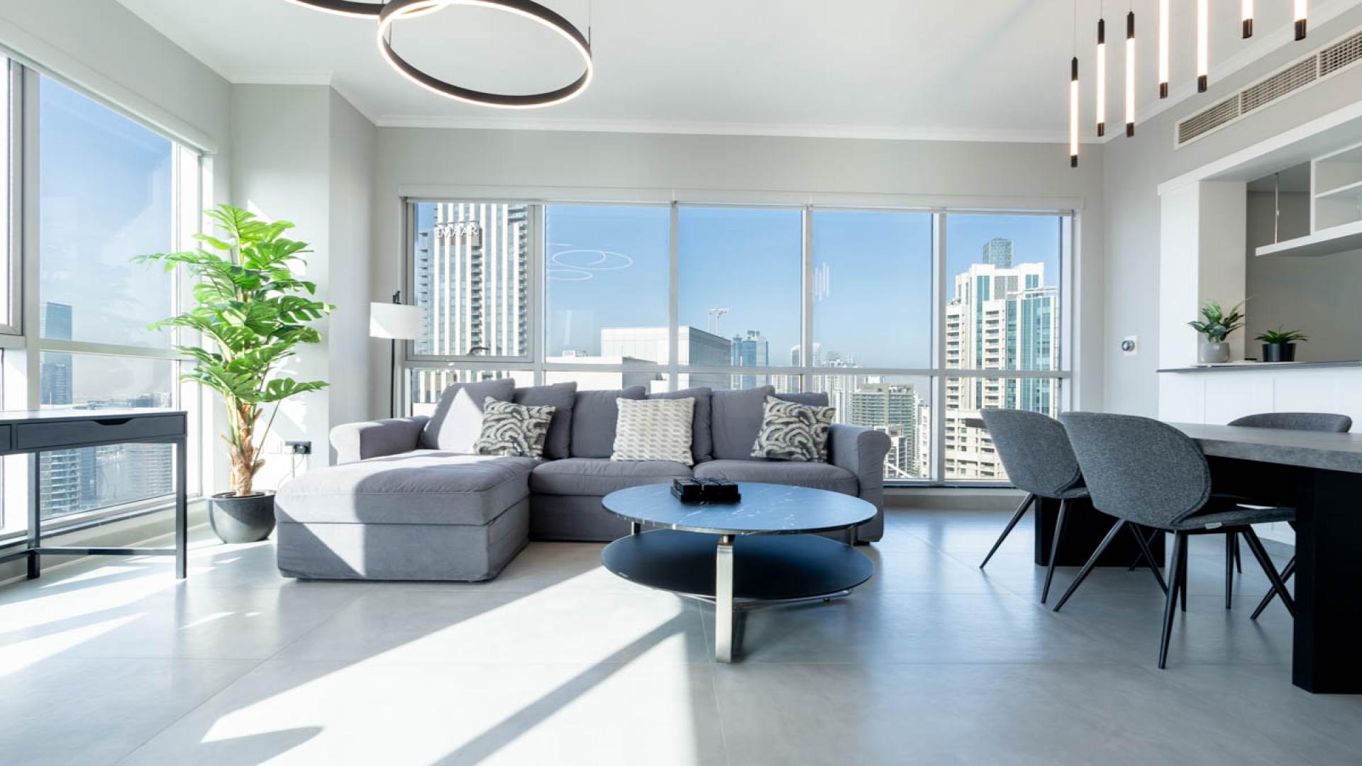Spacious furnished living room with city views in Downtown Dubai apartment for rent