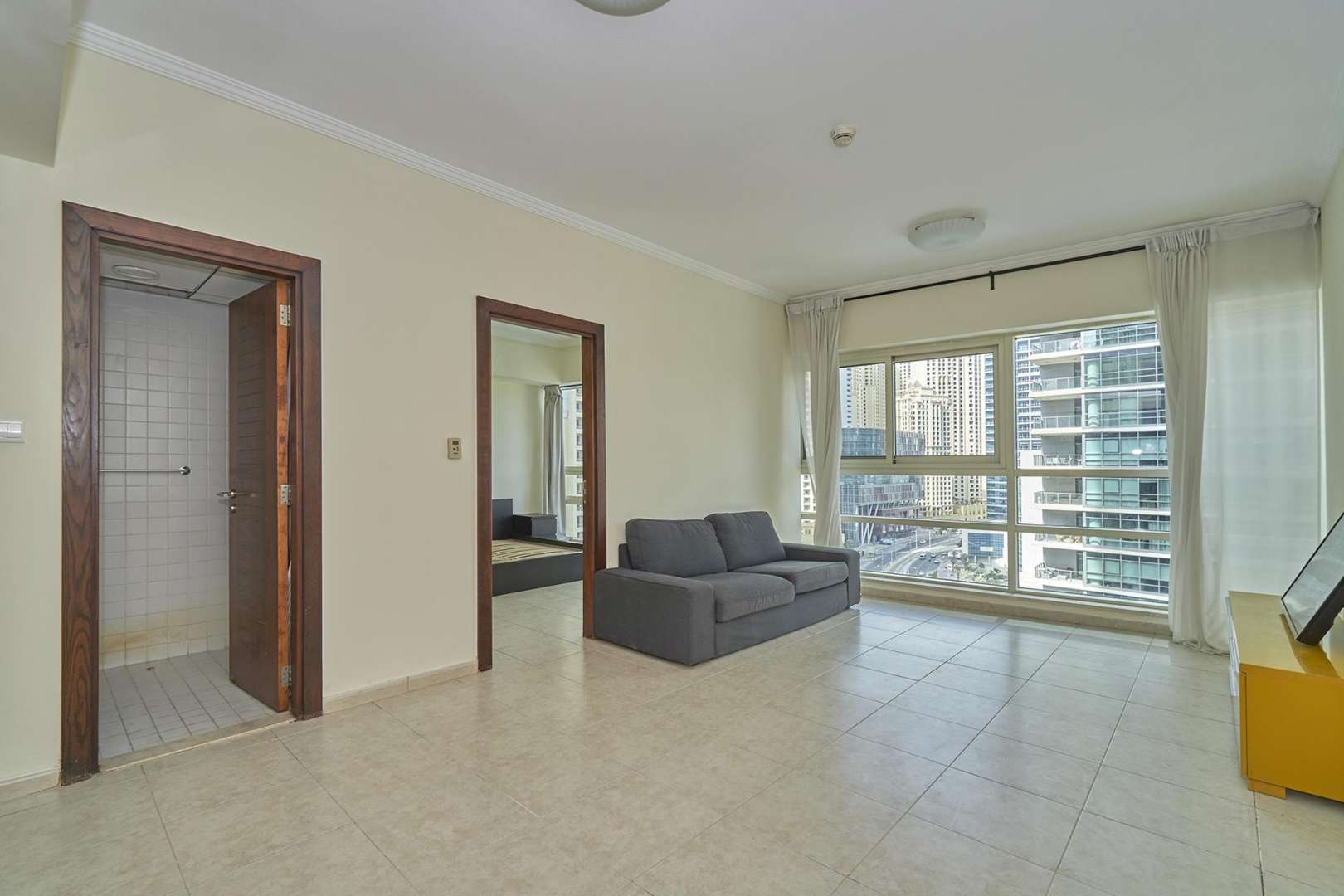 View of Dubai Marina from Al Sahab 2 apartment, showcasing waterfront and skyscrapers