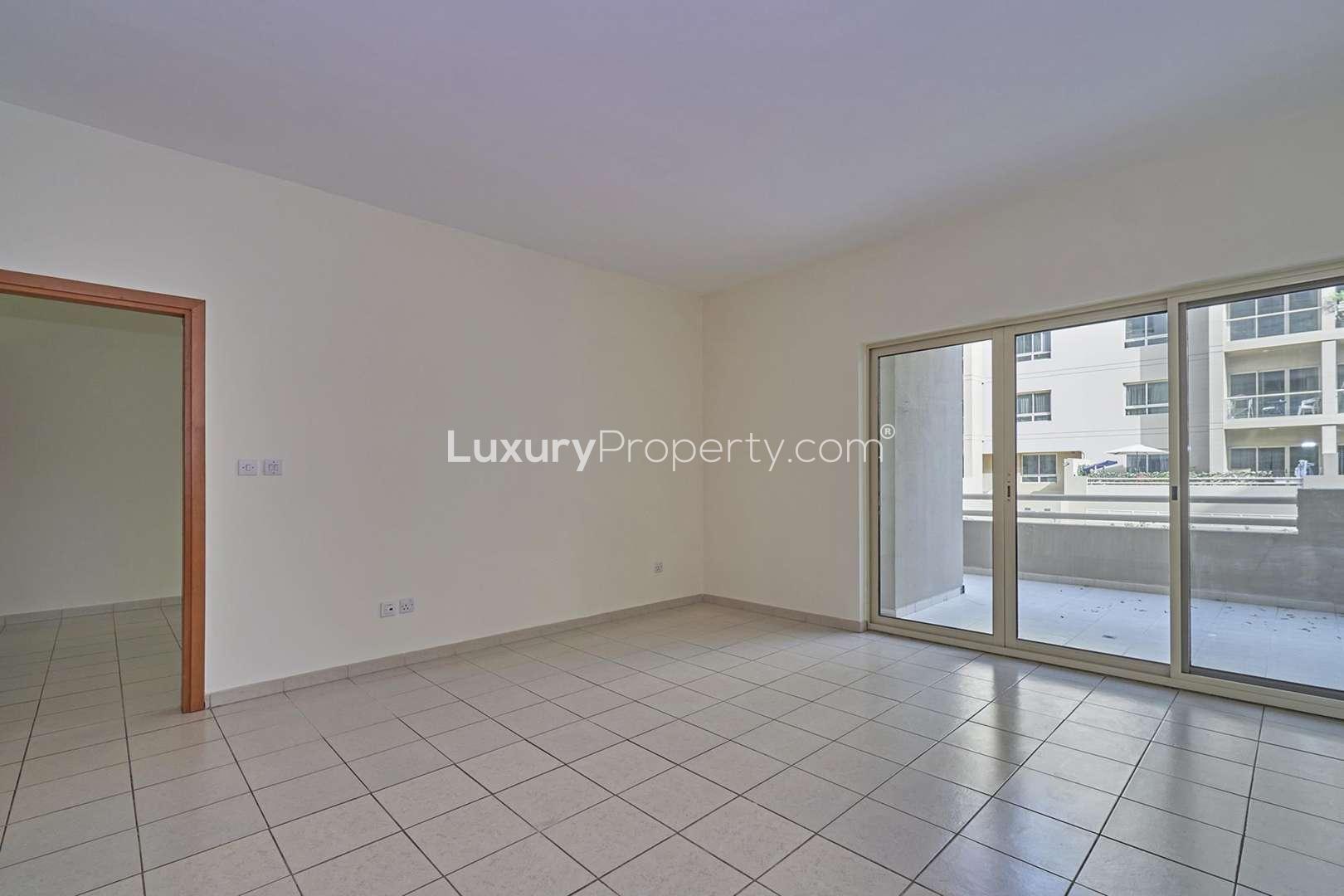 Spacious living area with open kitchen in Al Samar, The Greens apartment for rent